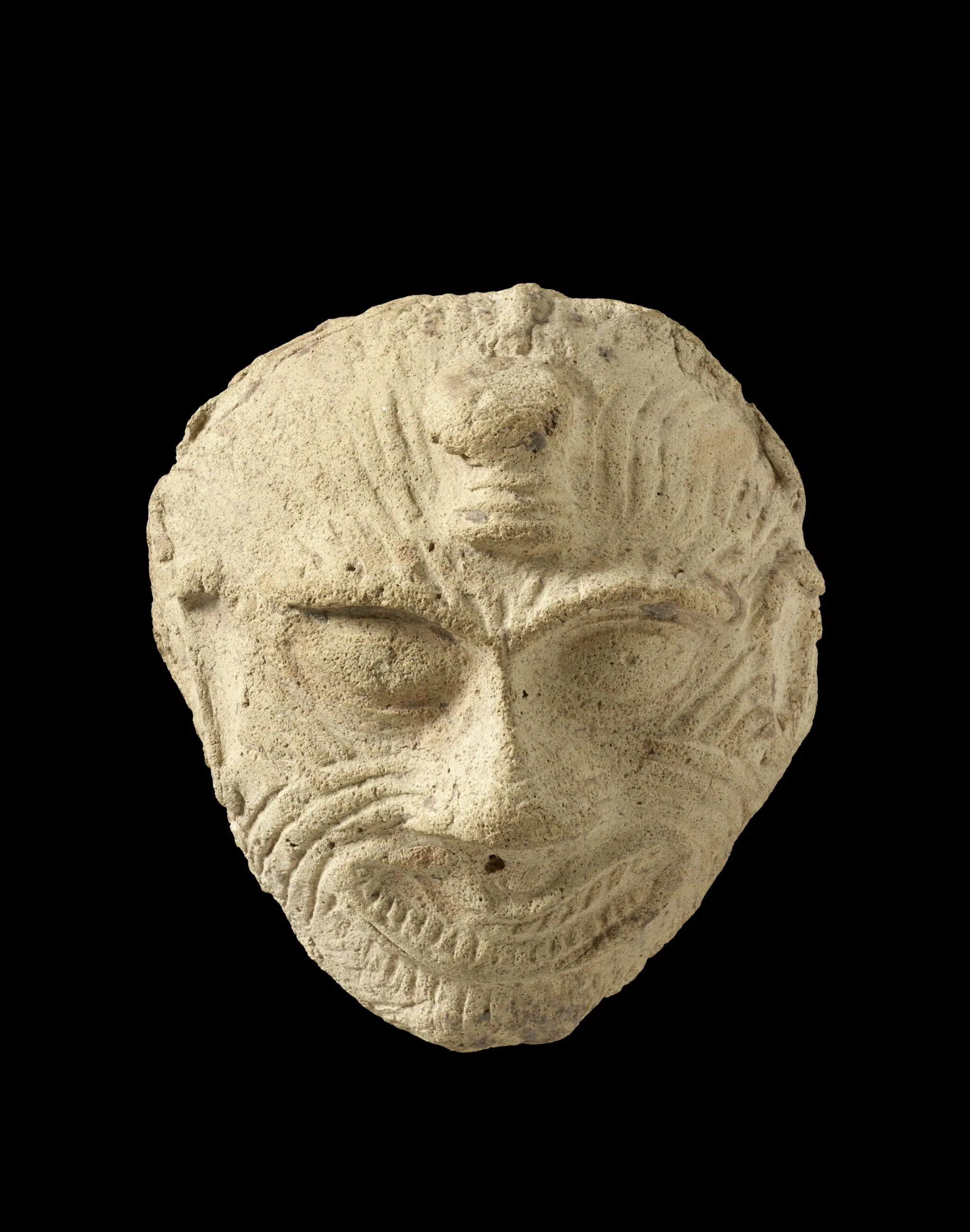 Mask of Humbaba. Old Babylonian, 2000-1700 BCE. Fired clay.