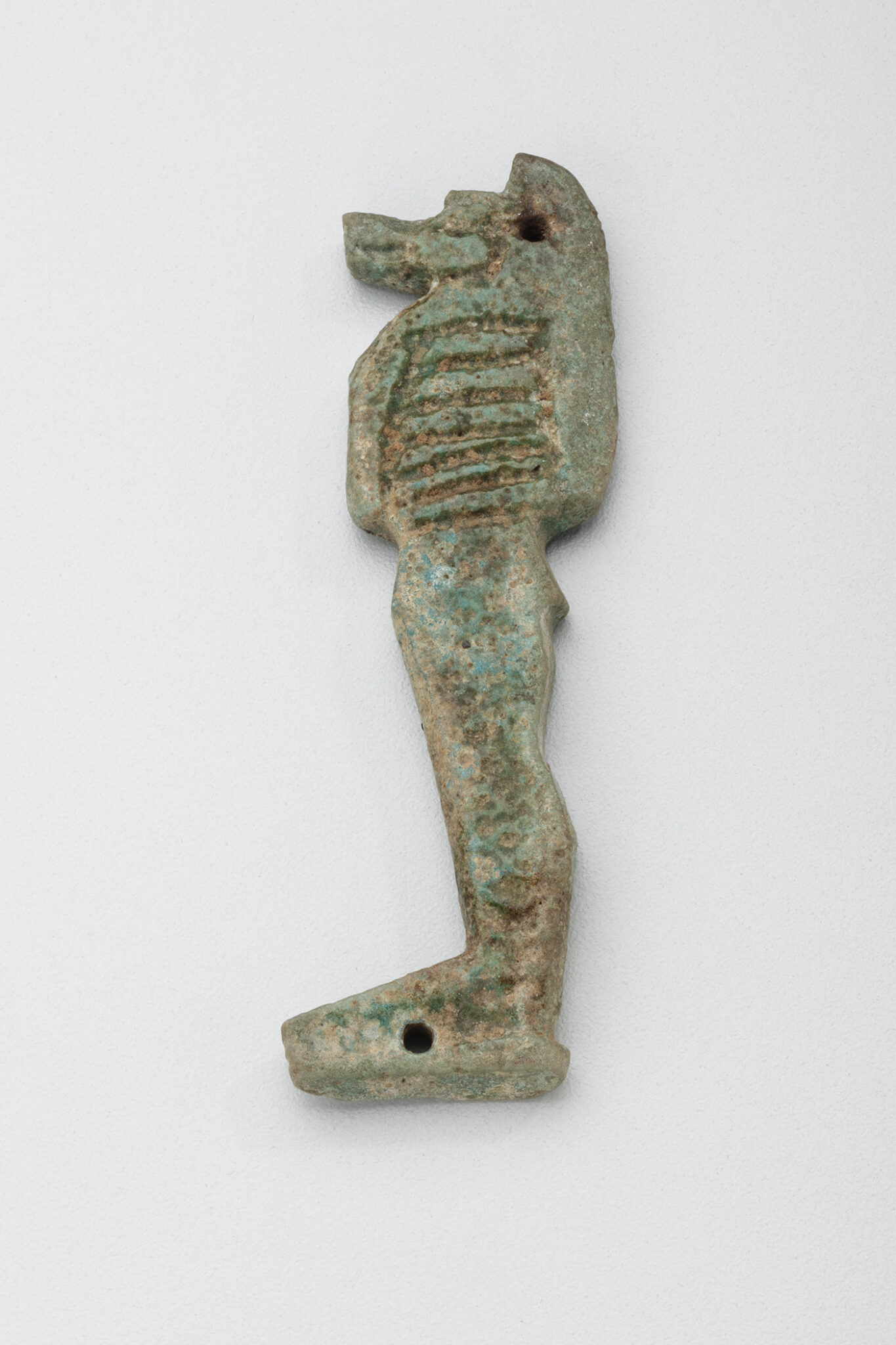 One of four amulets in a set depicting the sons of Horus. Egyptian, 23rd-25th Dynasties, 818-664 BCE. Faience.
