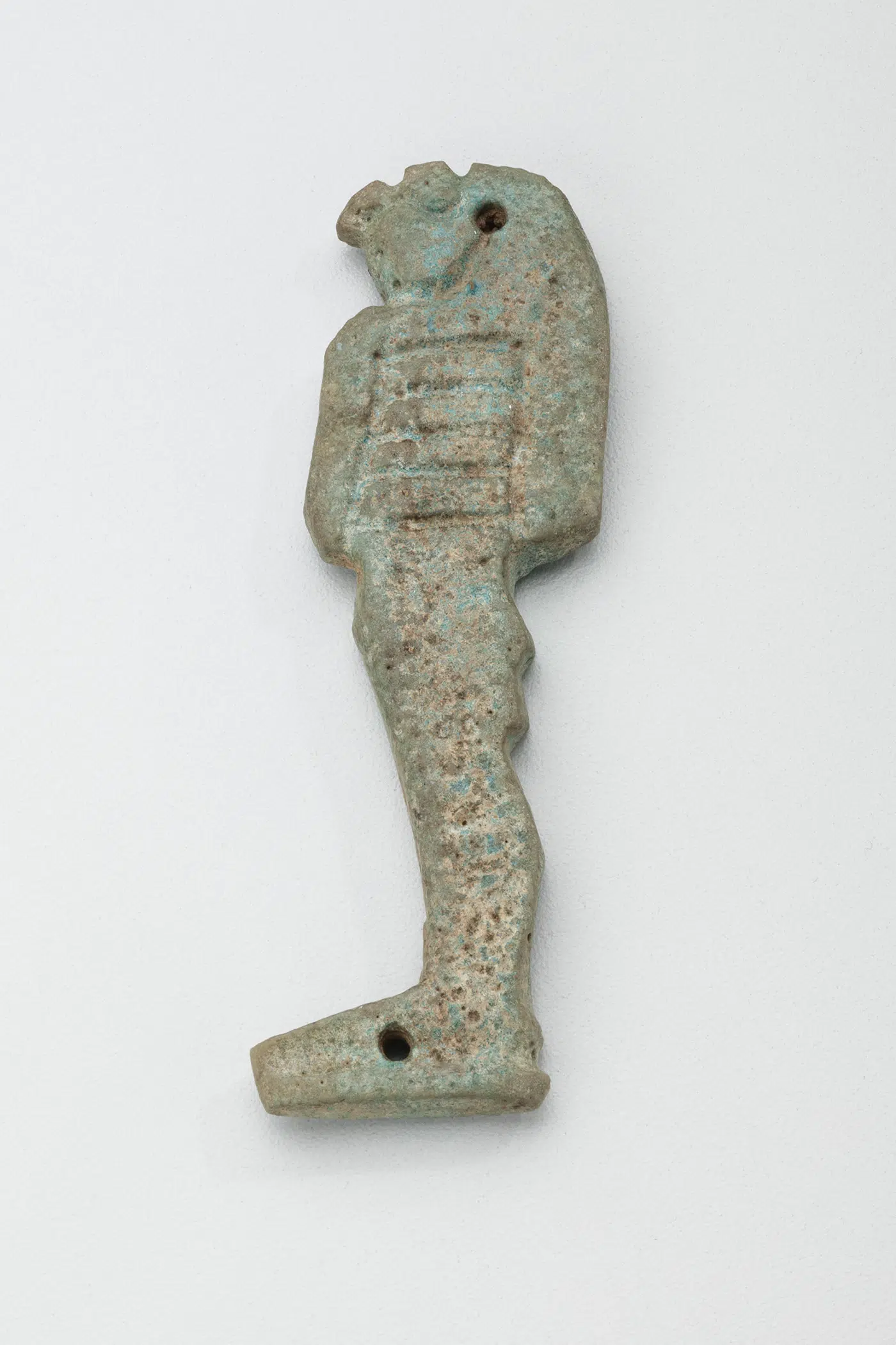 One of four amulets in a set depicting the sons of Horus. Egyptian, 23rd-25th Dynasties, 818-664 BCE. Faience.