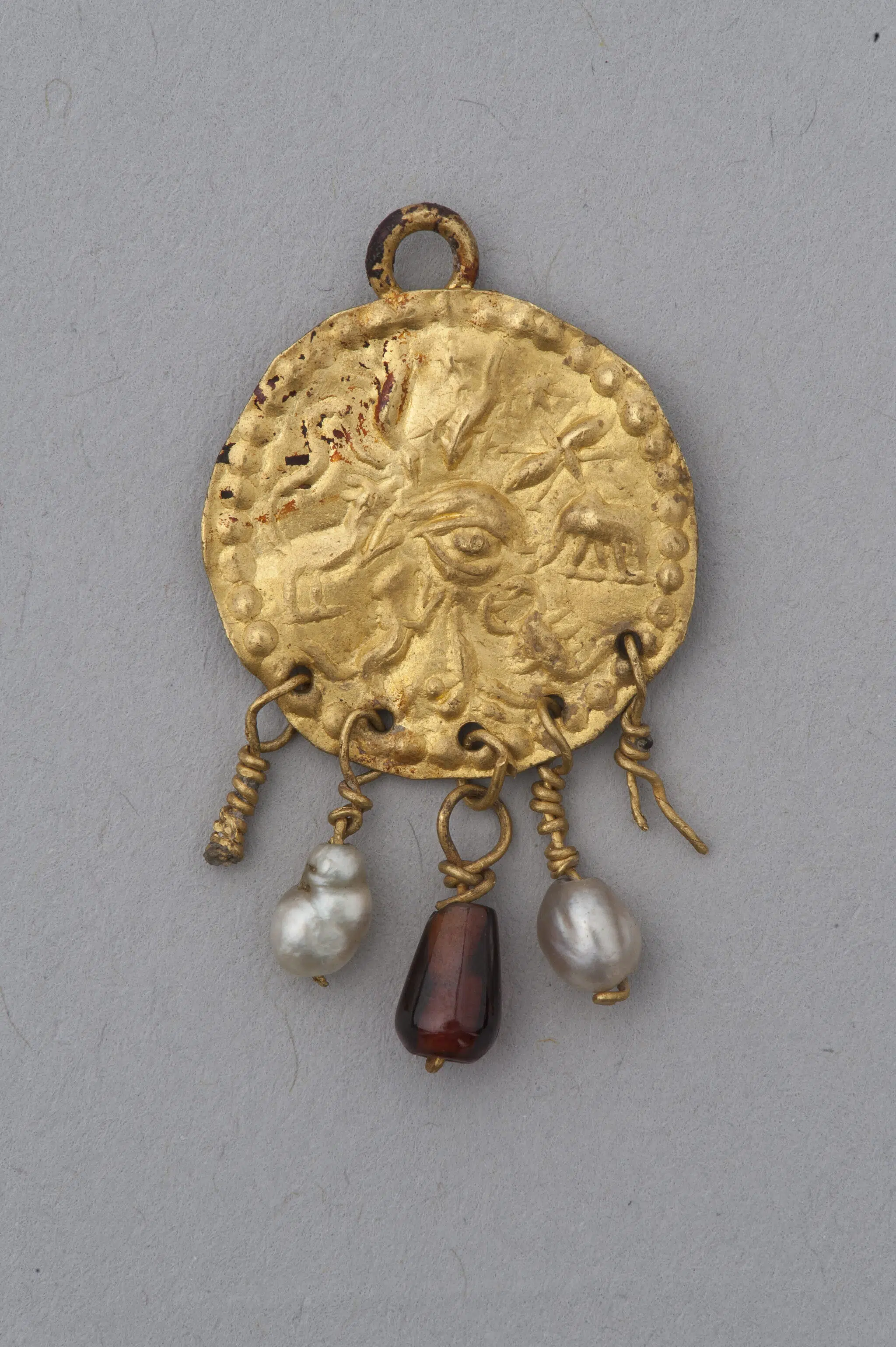 Pendant amulet against the evil eye. Roman, 2nd century CE. Gold, pearls, and amethyst.