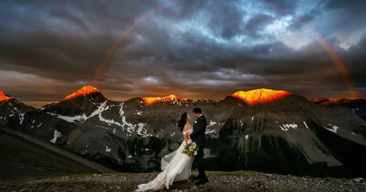 Bride and Groom Exchanging Wedding Vows Are Surprised by a Double Rainbow