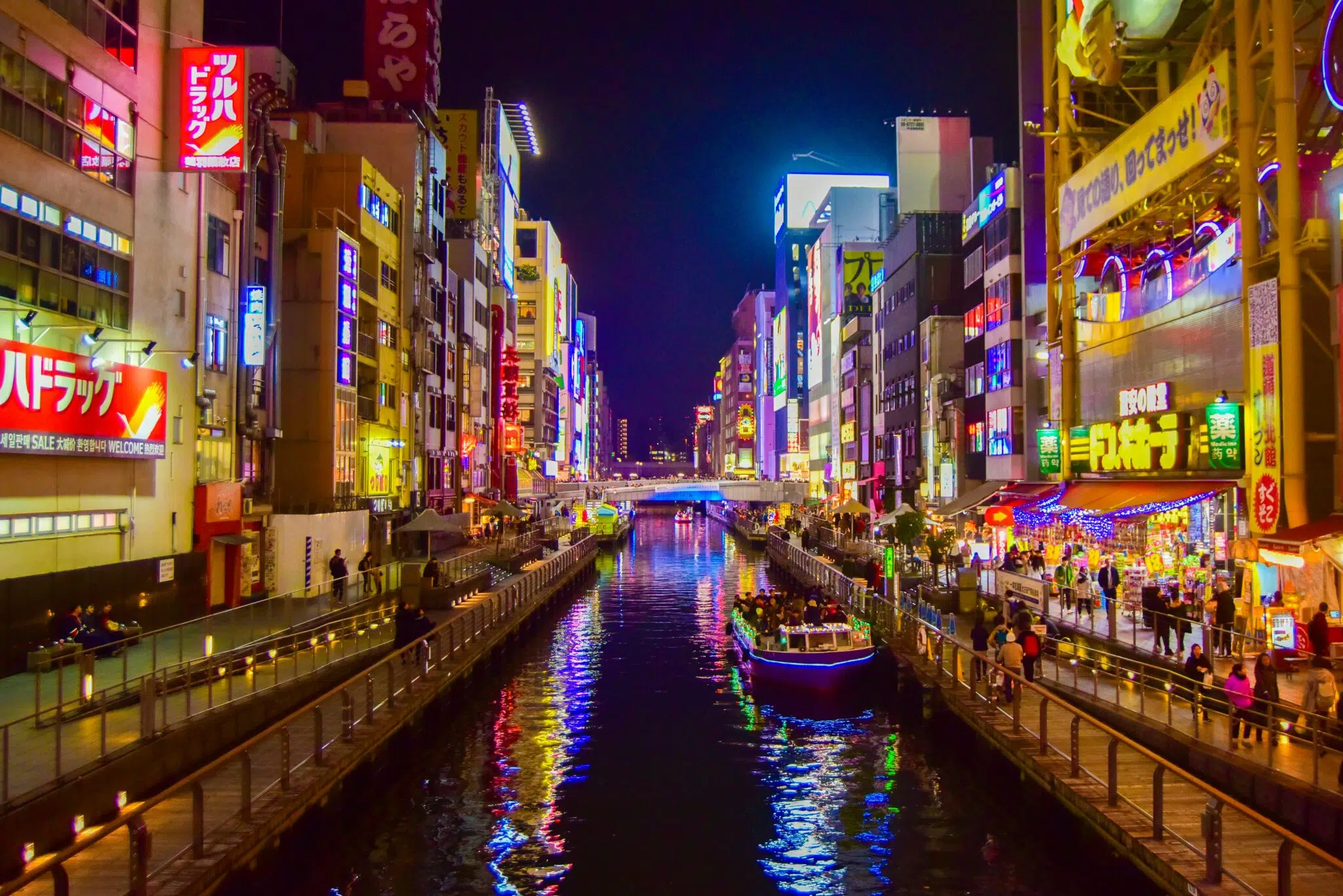 A boat on a river running through Osaka, Japan