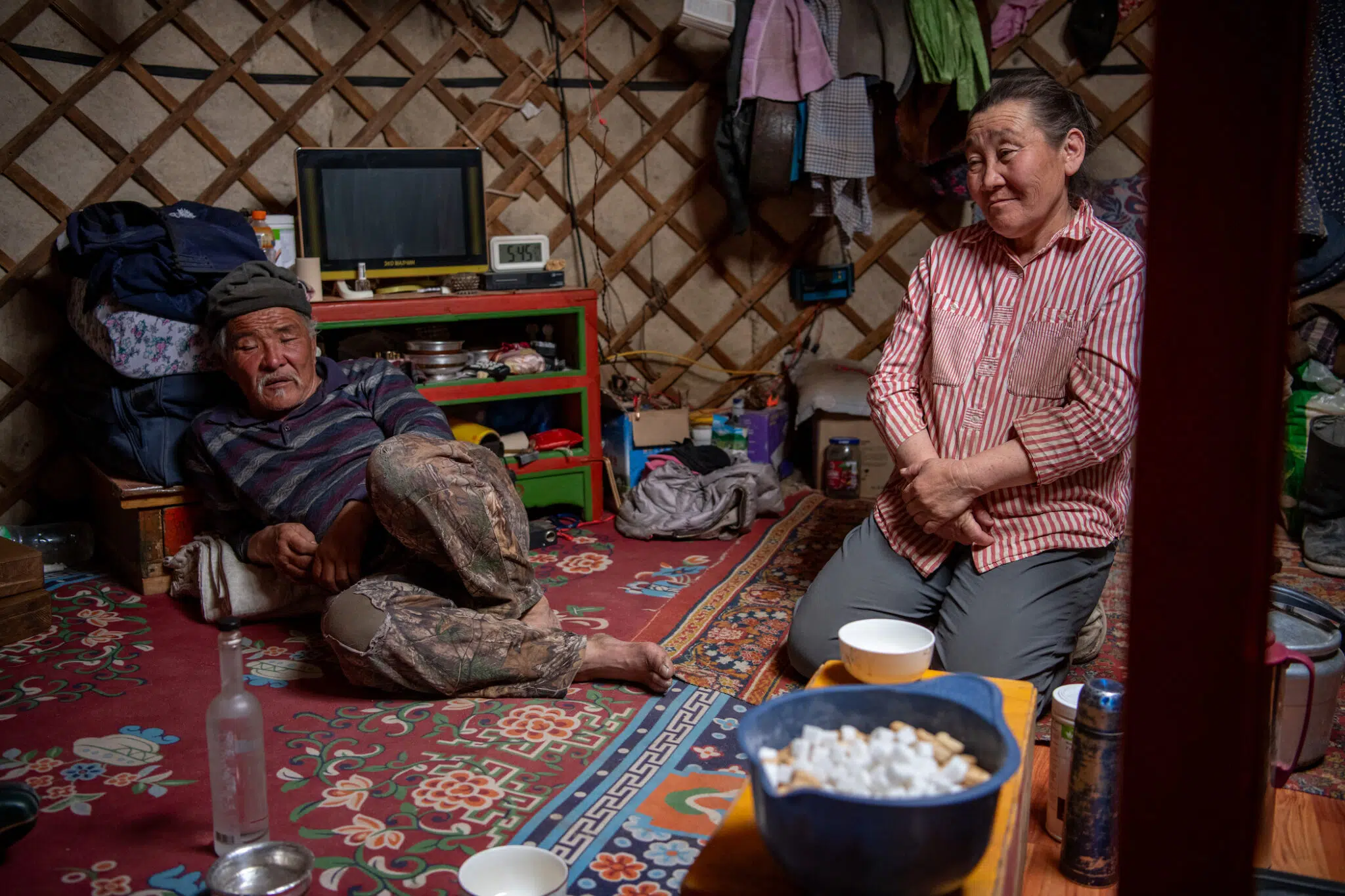 59-year-old Bayanbileg and his wife, Odonchimeg, 58, parents of seven children, sit together inside their home in Mongolia’s Gobi Desert.