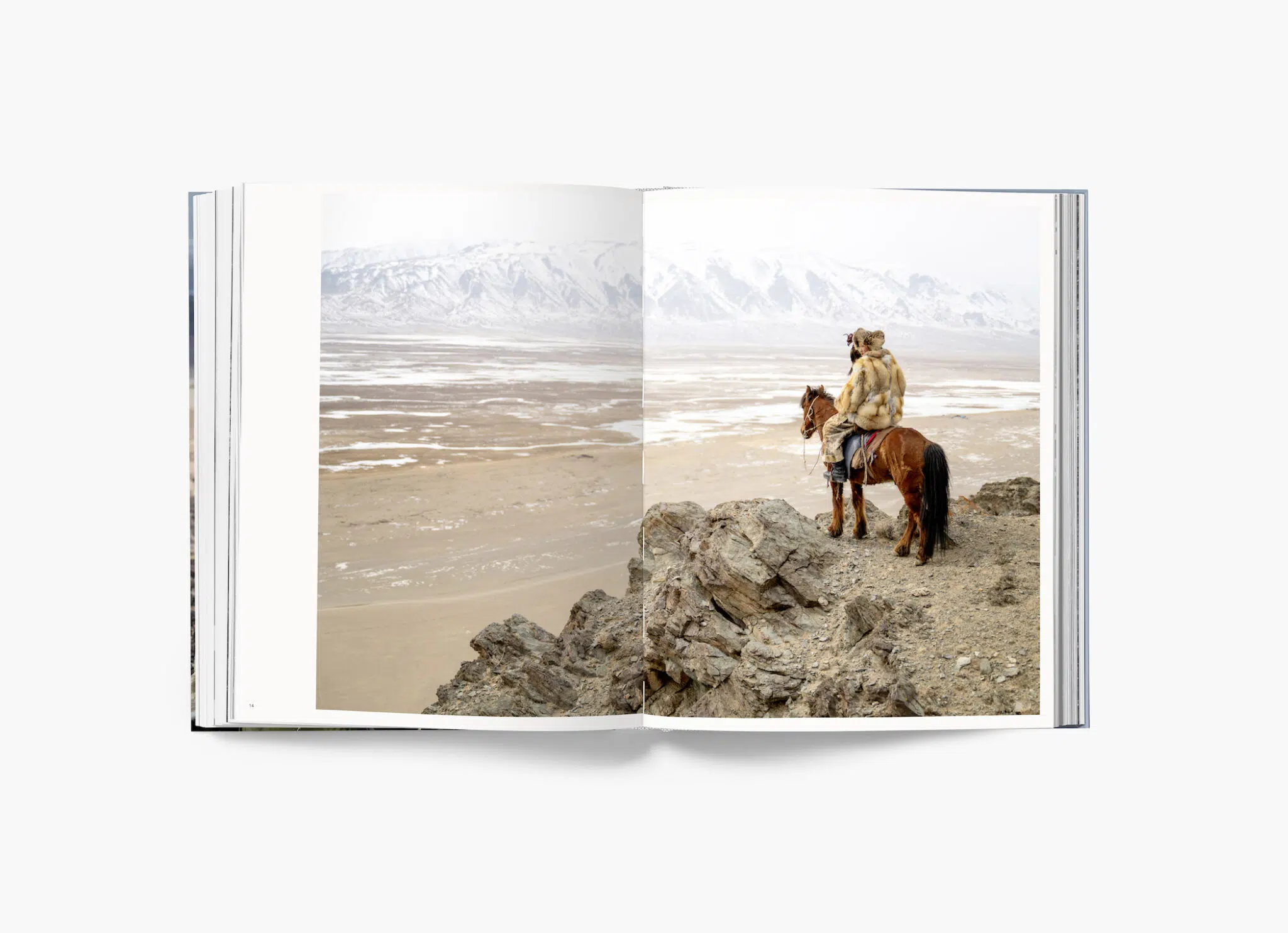 A spread from ”Altai: Hunters and Herders of Mongolia” by Claire Thomas, published by Hemeria