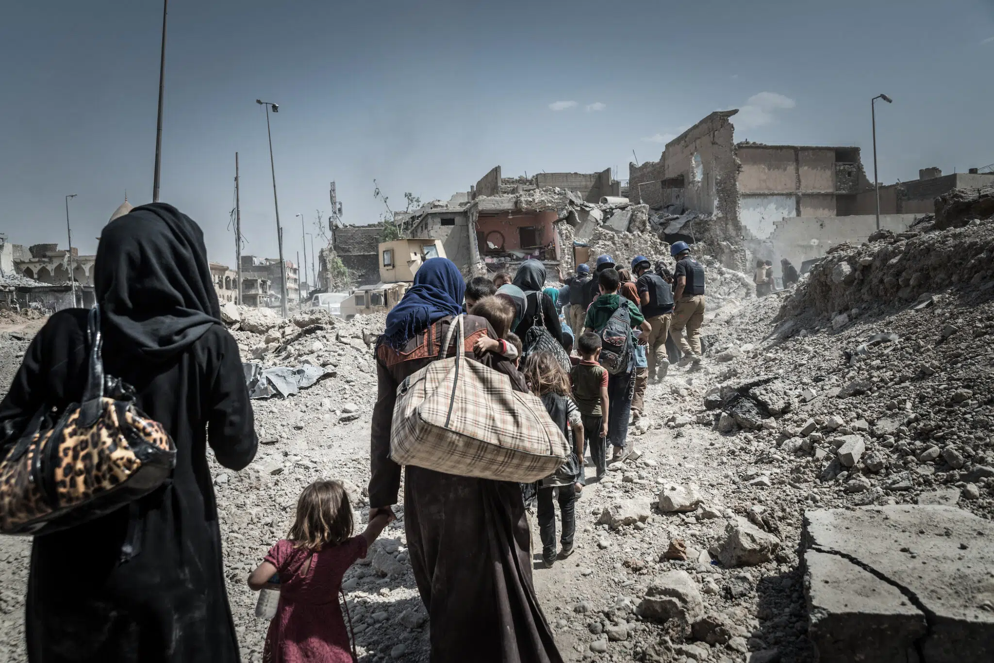 Civilians flee the Old City of Mosul as the fighting to liberate the remaining pocket of ISIS-held territory continues.