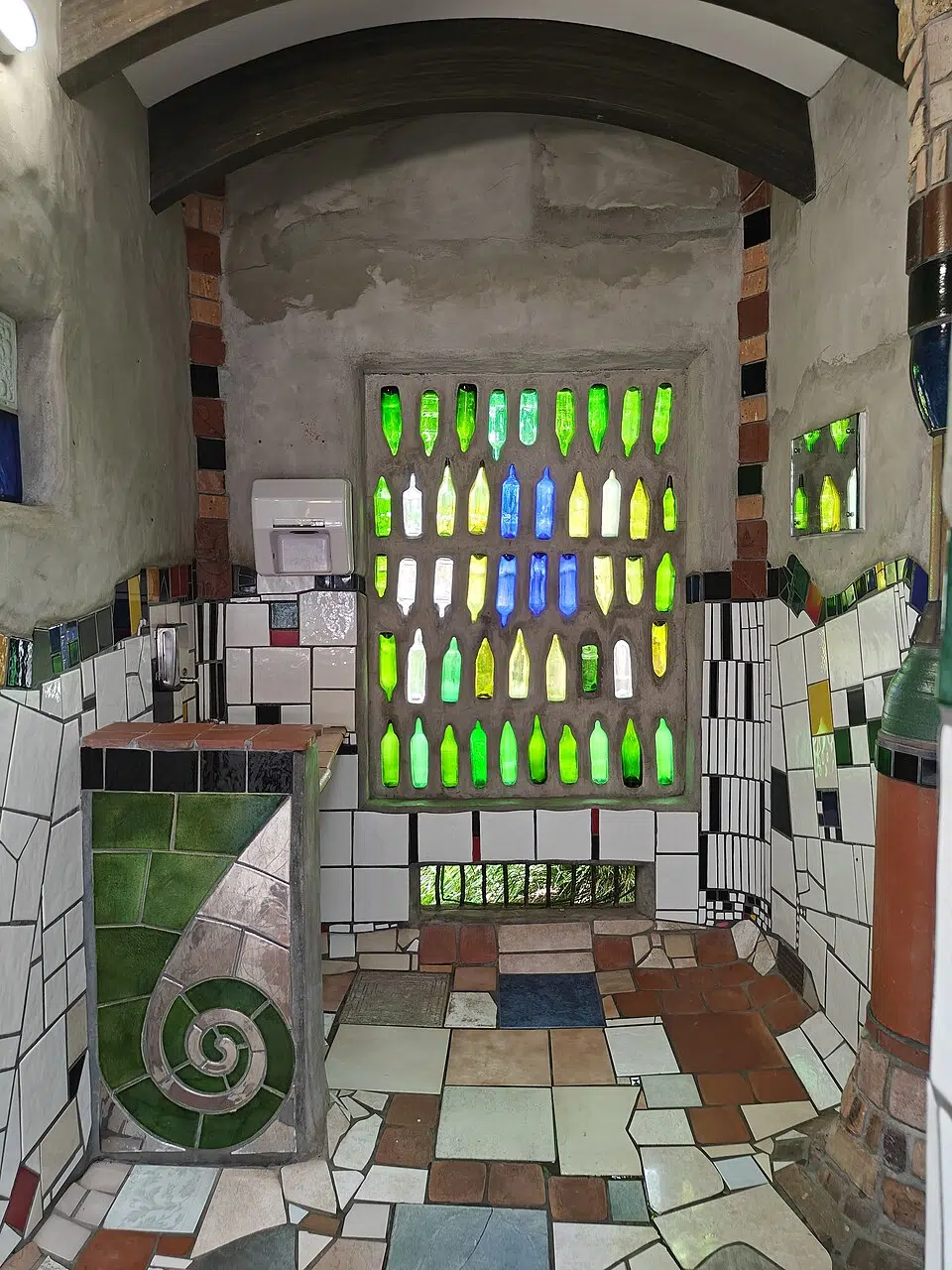 The back wall of Hundertwasser-designed public toilets in Kawakawa, a small town in New Zealand&rsquo;s Northland region