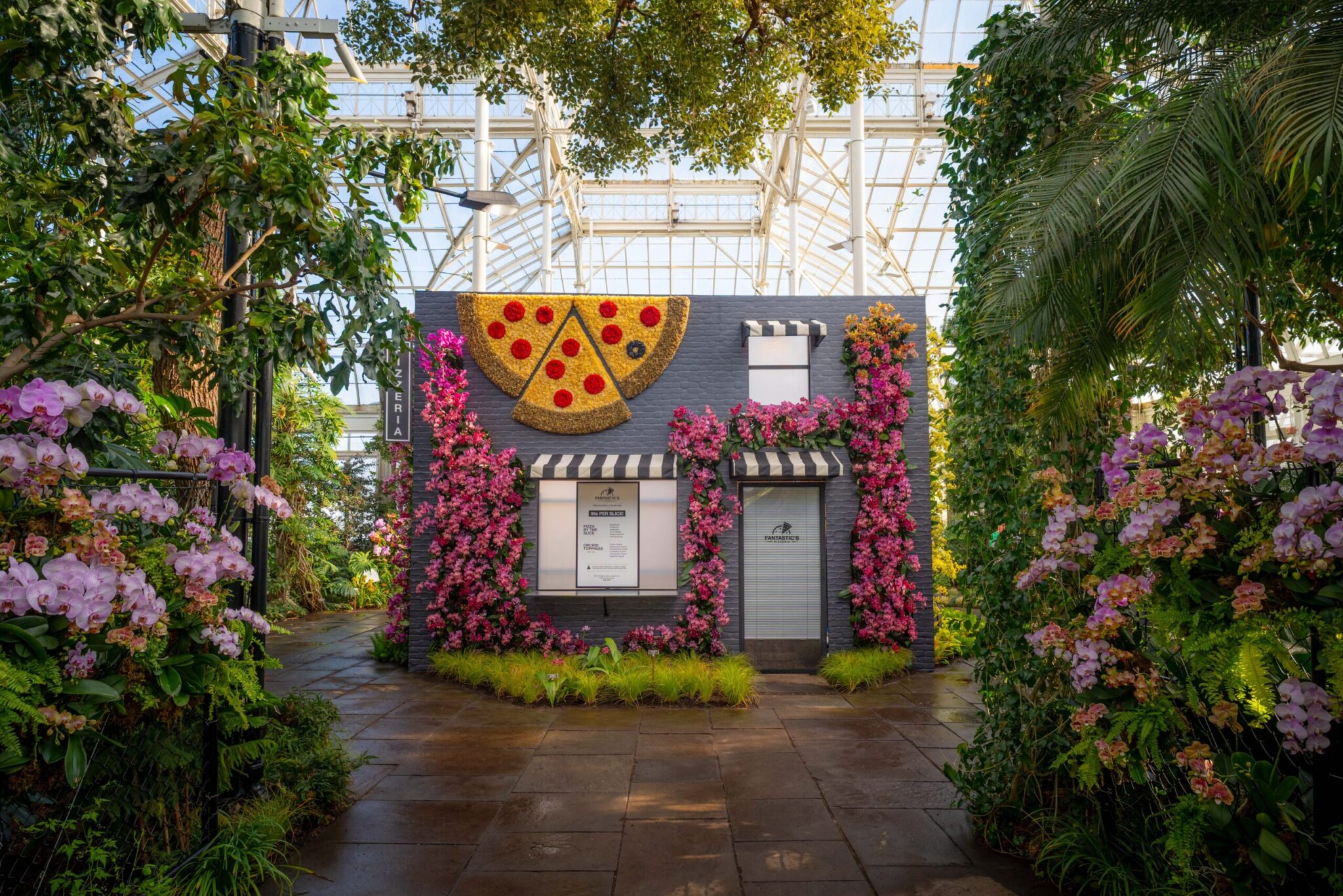 Pizza stop featured in &ldquo;The Orchid Show: Mr. Flower Fantastic&rsquo;s Concrete Jungle,&rdquo; on view at NYBG in the Bronx.