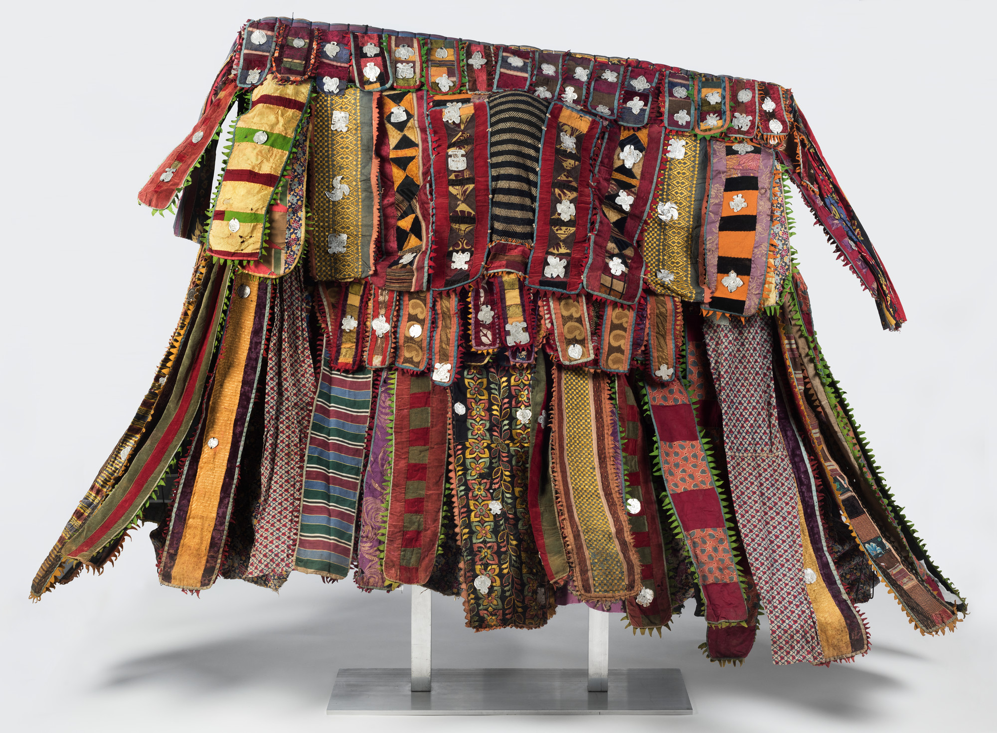 Yor&ugrave;b&aacute; artist, &ldquo;Paka Eg&uacute;ng&uacute;n&ldquo; (Masquerade Dance Costume). Lekewọgbẹ compound, &Ograve;gb&oacute;mọ̀ṣọ́, Ọ̀yọ́ State, Nigeria, ca. 1920&ndash;48. Cotton, wool, wood, silk, synthetic textiles, indigo, and aluminum