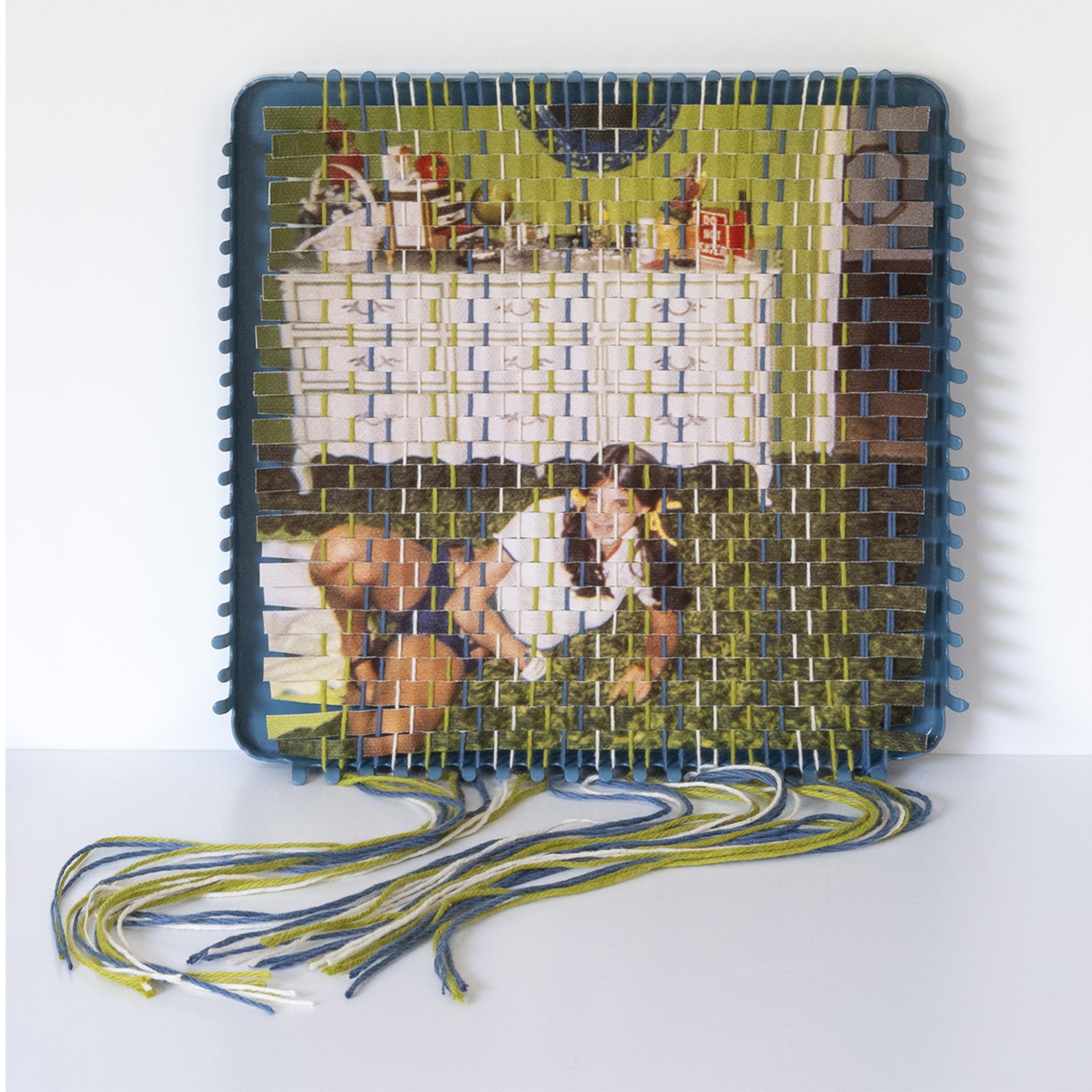A family photograph that has been torn apart and resewn using a vintage pot holder loom, created by Pam Connolly for her &ldquo;Columbus Drive&rdquo; series