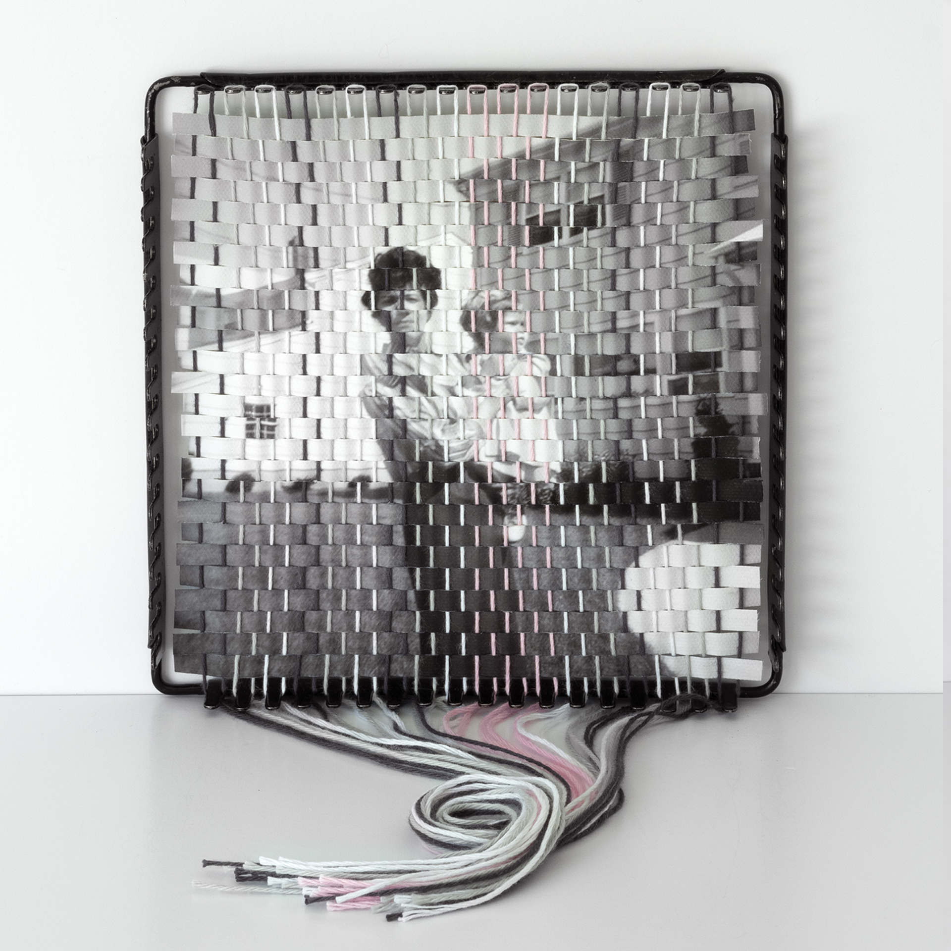 A family photograph that has been torn apart and resewn using a vintage pot holder loom, created by Pam Connolly for her &ldquo;Columbus Drive&rdquo; series