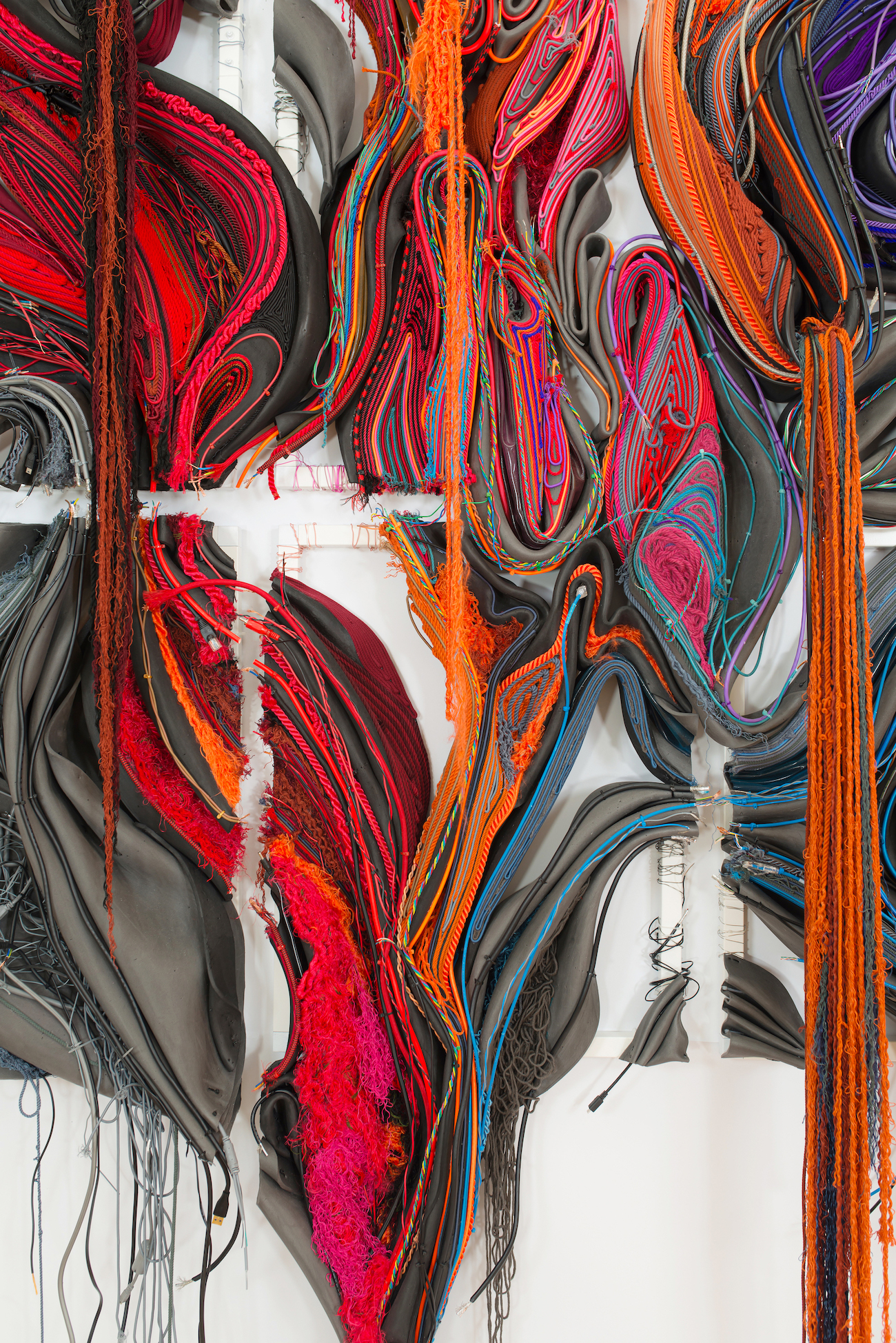 Glimpse, 2025. String, yarn, discarded electrical cable, rubber tube, elastic cord, foam, and cloth.