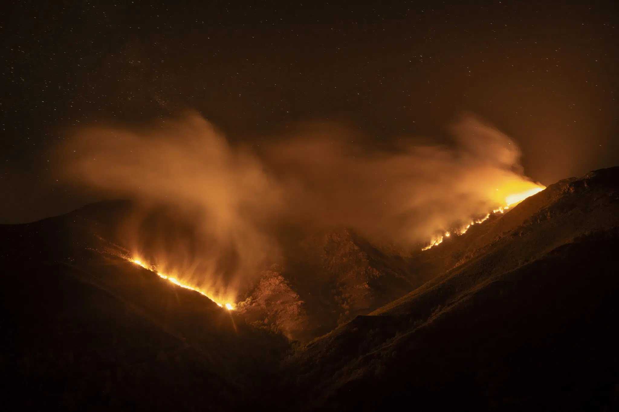 Brais Lorenzo, &ldquo;Burned Land,&rdquo; for El Pa&iacute;s. The Larouco wildfire, the worst in Galicia&rsquo;s recorded history, burns through the night as flames reach O Courel&mdash;a mountain range of great biodiversity. Sierra de O Courel, Galicia, Spain, August 19, 2025.