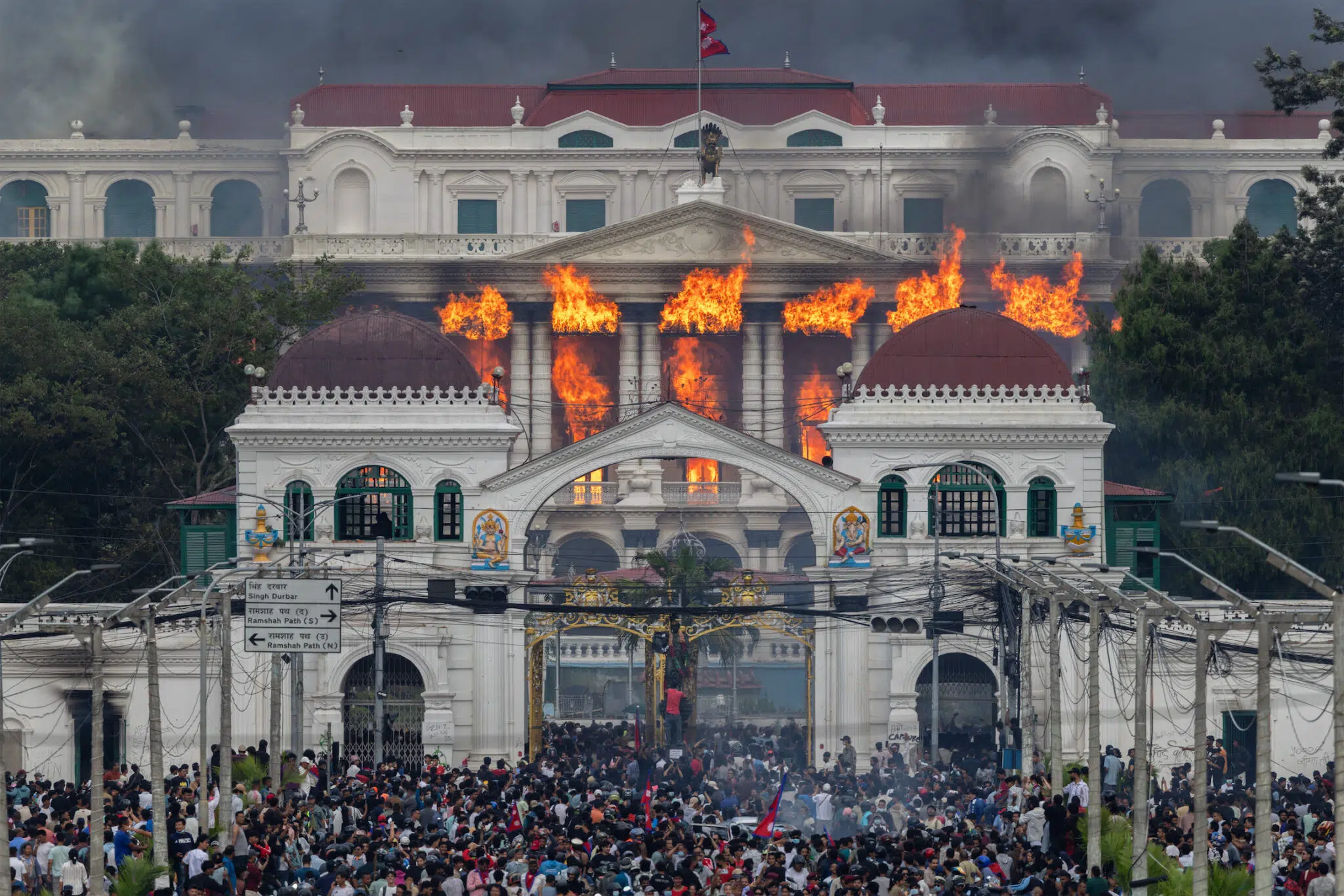 Narendra Shrestha, &ldquo;Nepal&rsquo;s Gen Z Uprising,&rdquo; for EPA Images. Fire and smoke engulf Singha Durbar after protesters stormed and set the government complex alight during violent demonstrations. Kathmandu, Nepal, September 9, 2025.
