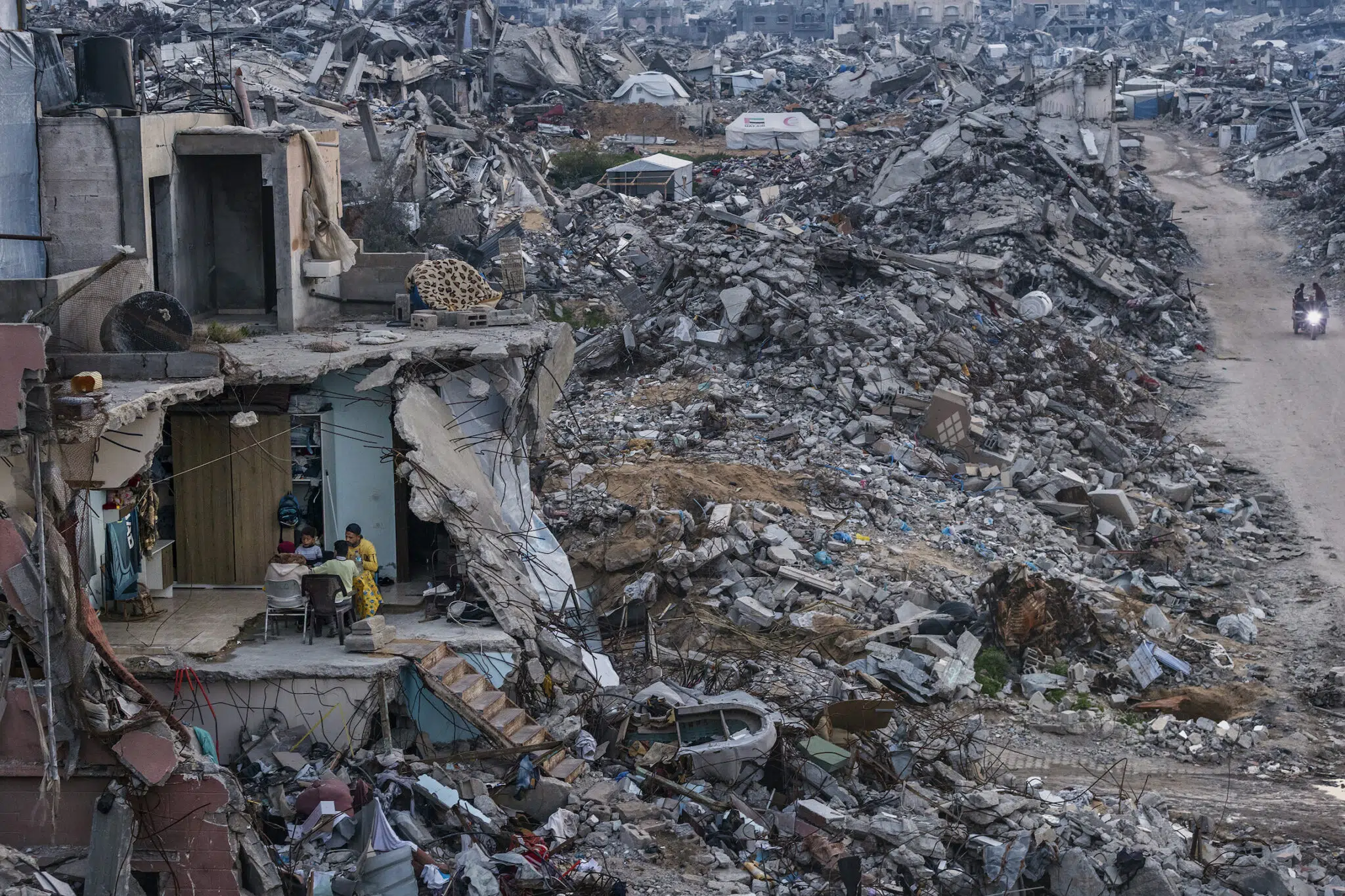 Saher Alghorra, &ldquo;Witnessing Gaza,&rdquo; for the New York Times. Tamer Hassan al-Shafei and his family break their Ramadan fast in the remains of their home. Food shortages meant only basics were served instead of the usual spread. Beit Lahia, Gaza Strip, March 4, 2025.