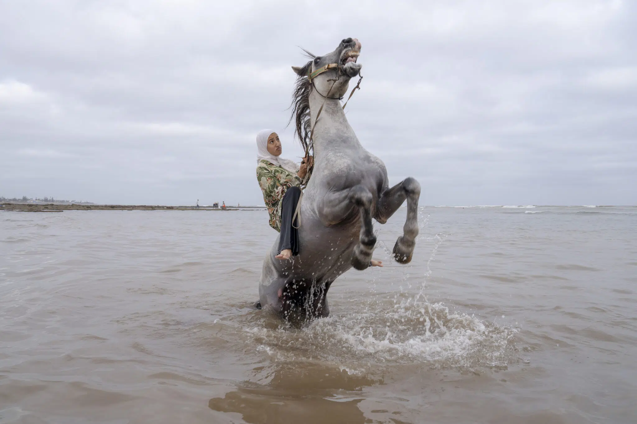 Chantal Pinzi, &ldquo;Farīsāt: Gunpowder&rsquo;s Daughters,&rdquo; for Panos Pictures. Ghita Jhiate manages her unruly stallion. Long forbidden by her father to participate in Tbourida, she finally realized her dream of riding alongside pioneer Zahia Aboulait in 2025. Sidi Rahal, Morocco, August 6, 2025.