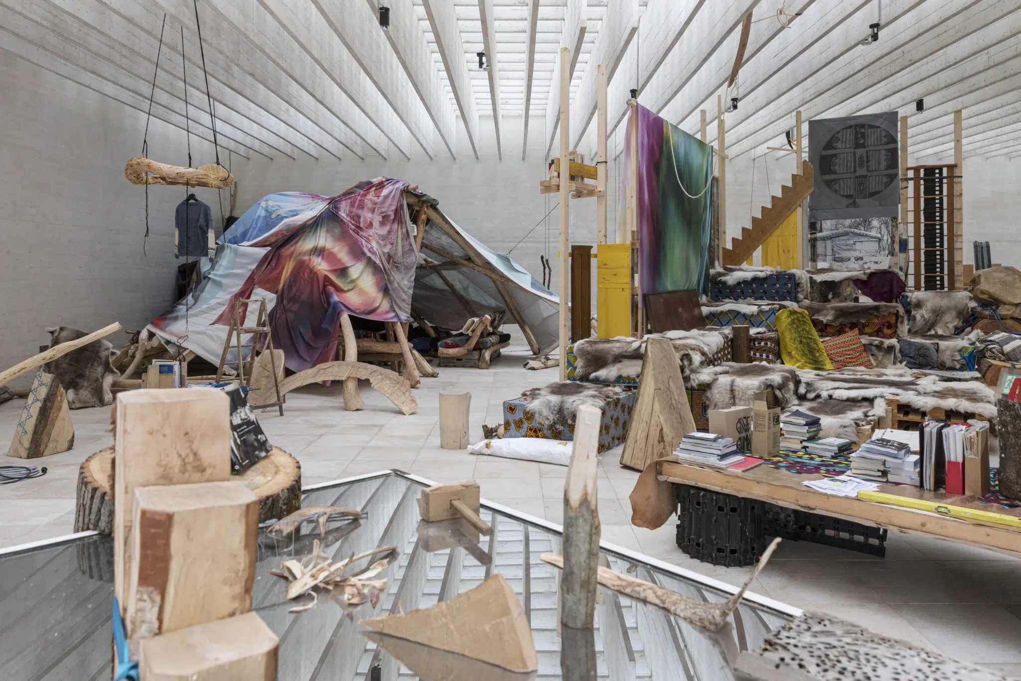 Joar Nango, &ldquo;Girjegumpi: The S&aacute;mi Architecture Library,&rdquo; 2023, installed at the Nordic Countries Pavilion at the 18th International Architecture Exhibition, Venice Biennial. (Photo: Laurian Ghinițoiu, courtesy of the artist)