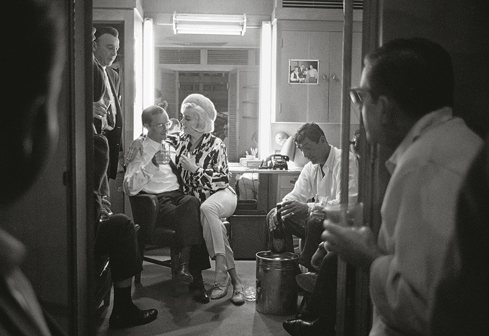 Monroe celebrates her 36th birthday on the set of &ldquo;Something&rsquo;s Got to Give&rdquo; with co-stars Wally Cox (l.), Dean Martin (r.), and Martin&rsquo;s driver (standing). 