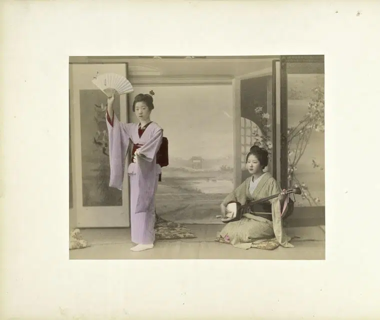 Hand-colored photograph of two women in 19th-century Japan