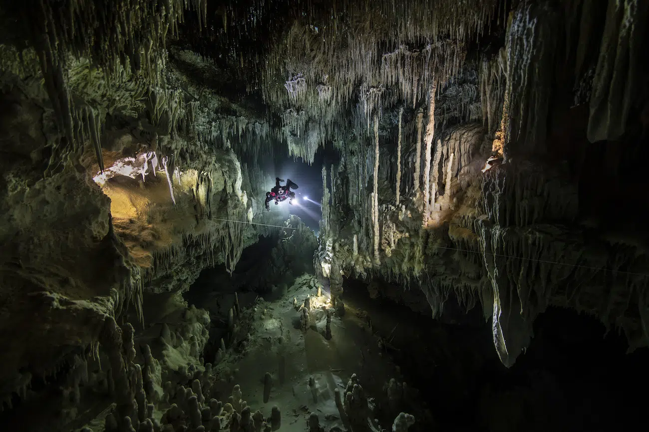 &copy; Valentina Cucchiara (Italy). Connecting Oceans &mdash; Winner Suspended in the pristine darkness of Cenote Nariz, a diver illuminates a breathtaking ancient underwater world formed drop by drop over millennia. This vast subterranean aquifer serves as the vital heart of Mexico&rsquo;s Yucat&aacute;n Peninsula, acting as the primary source of fresh water that sustains its sprawling jungles, diverse wildlife, and human communities. Known to the Maya as &ldquo;Suhuy Ja&rsquo;&rdquo;&mdash;or sacred water&mdash;these submerged networks represent an interconnected ancestral legacy that has nurtured life across countless generations. Tragically, this irreplaceable geological marvel is currently under serious threat. We have a profound obligation to protect this fragile ecosystem from destruction so these sacred subterranean rivers may continue to support future generations.