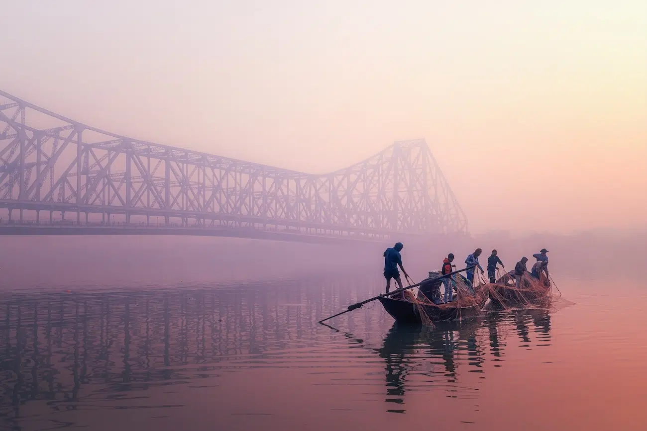 People in boat catching early morning catch
