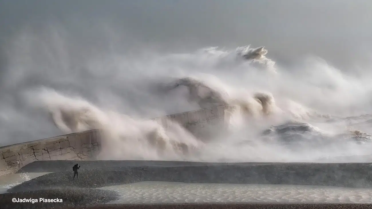 Crashing waves over beach