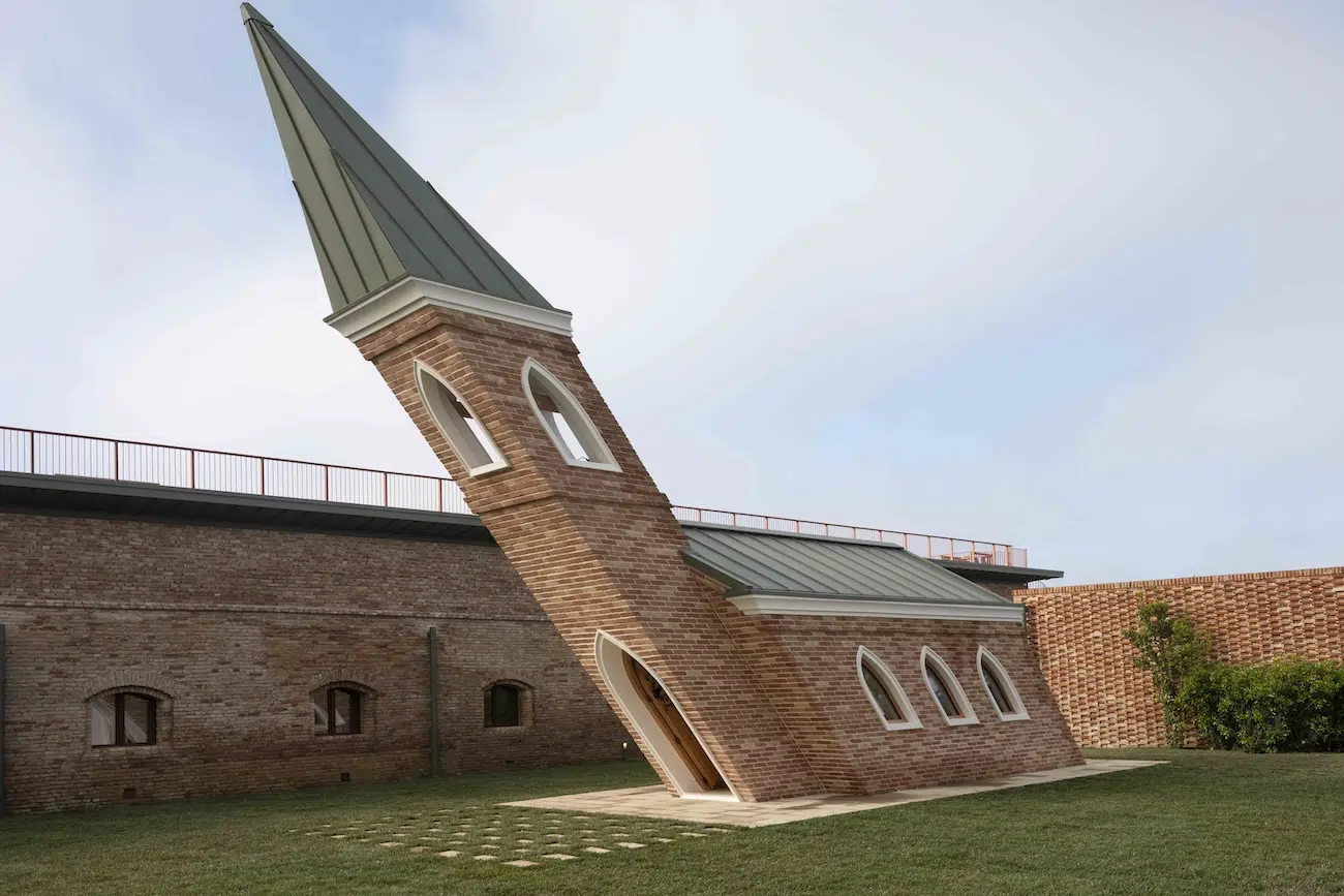 Brick chapel leaning 40 degrees forward, 3/4 view
