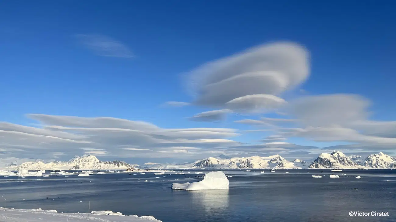 Inverted clouds over icy waters