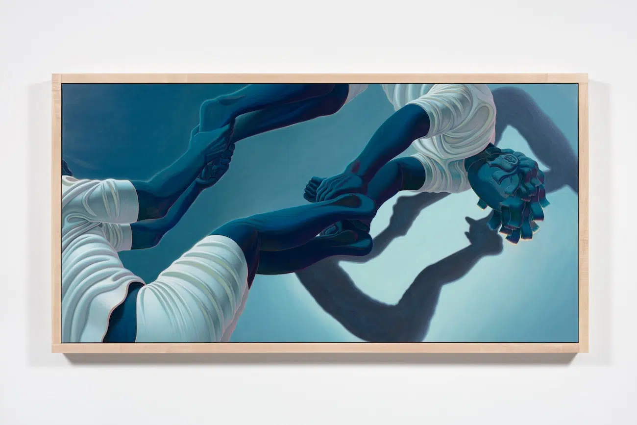 Figures holding each other in abstract shape.