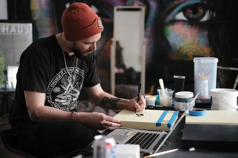 Person Drawing at Desk