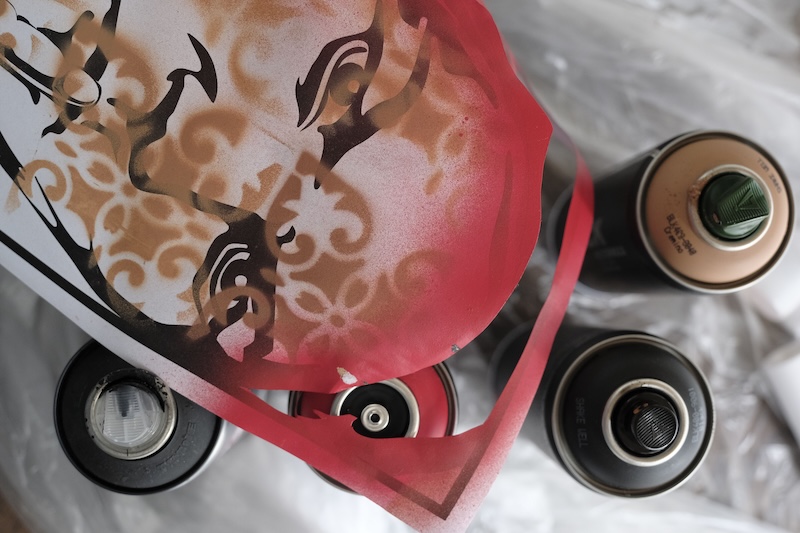 Face with stencil motifs on it