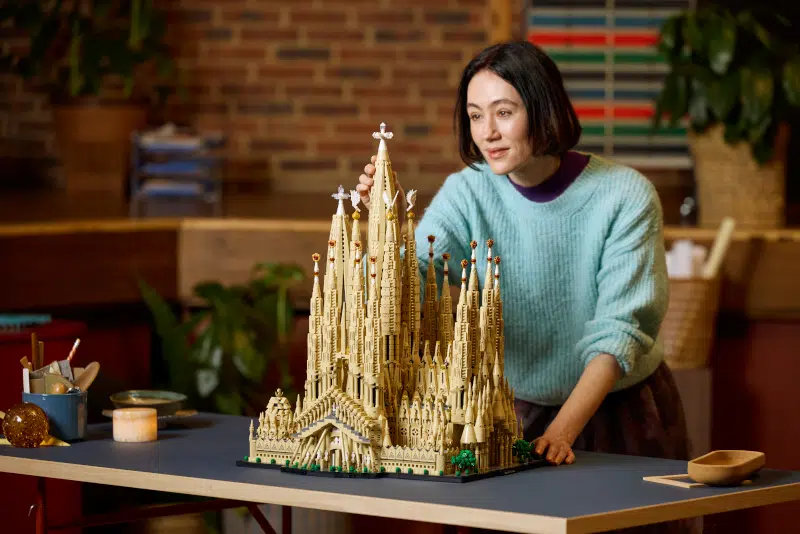 Woman assembling LEGO Sagrada Família set