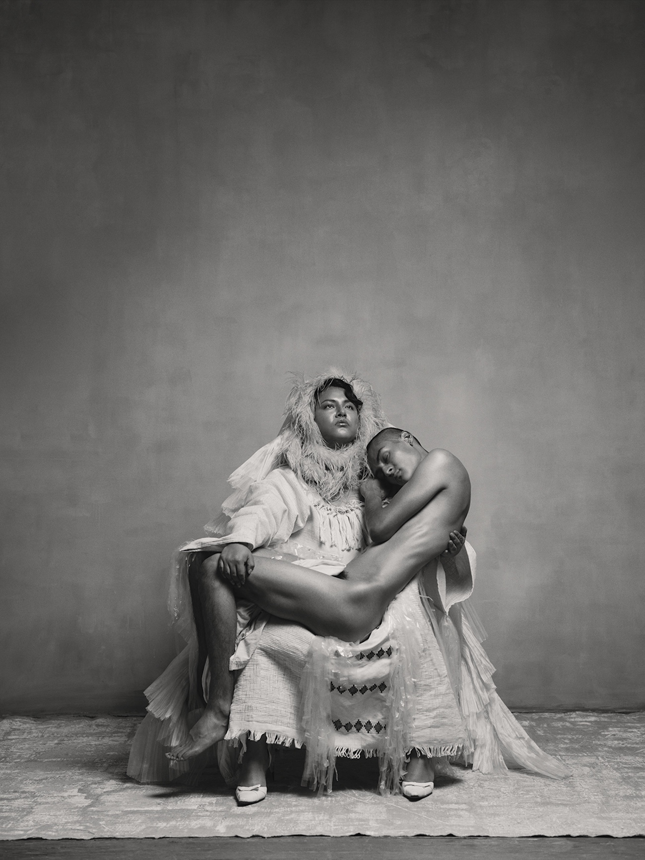 Portrait of one person holding another person. 