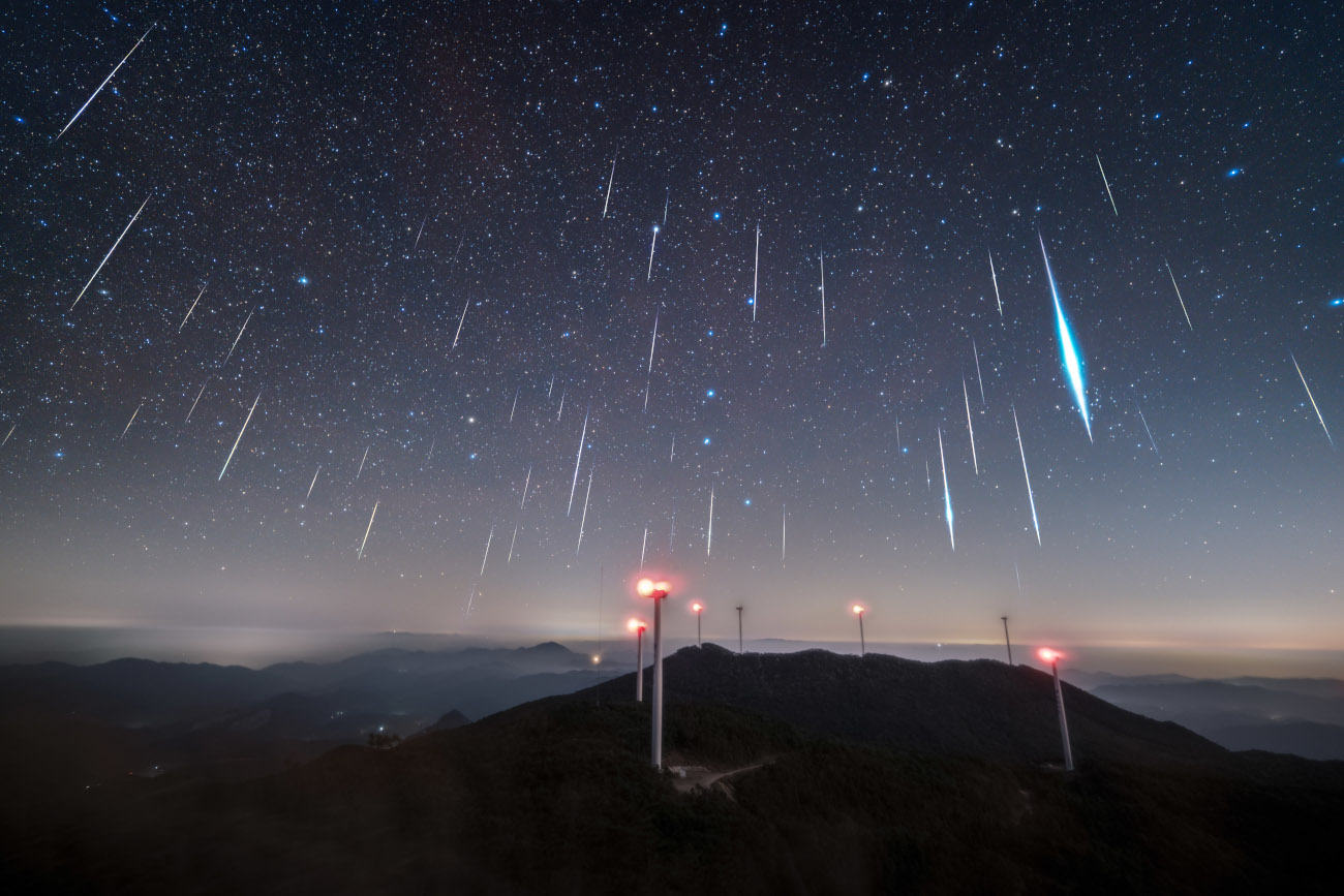Skyscapes. "Meteor Shower" Over the Big Dipper &copy; ZhiPu Wang (China). The Geminid meteor shower was once again reliable in 2025, with numerous bright meteors. After its radiant [the point from which the meteors appear to emanate] rose on the night of 14 December, the sky was filled with falling stars. ZhiPu Wang had originally planned to photograph only the Big Dipper, using a soft-focus filter to enhance the star points, but during the shoot he noticed a great number of meteors in the field of view, so adjusted his settings to capture them. Within three hours, he had captured dozens of meteors. Taken with a Nikon Z f camera, Viltrox 16 mm lens, 16 mm f/2, ISO 8000, 4-second exposure. Location: Sanming, Fujian Province, China, 15 December 2025