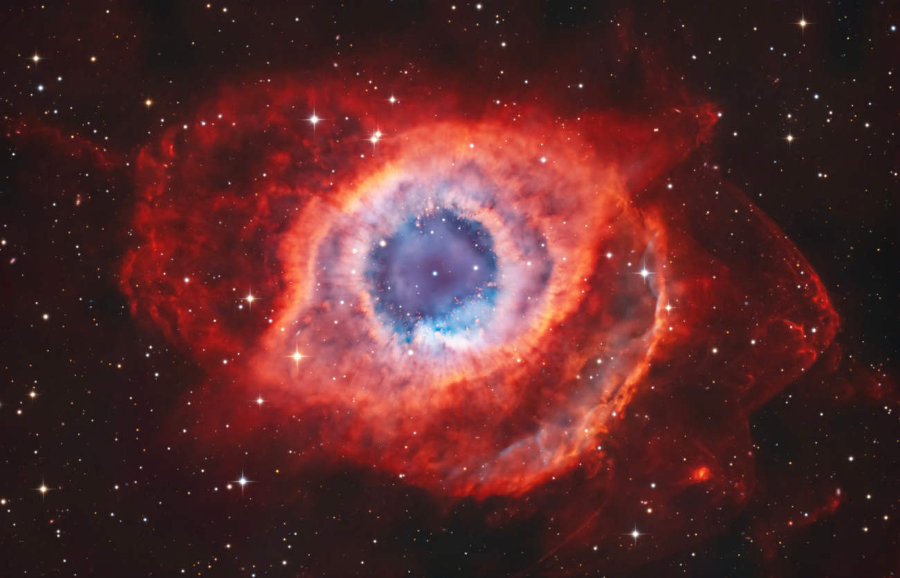 Stars & Nebulae. "NGC 7293: The Helix Nebula" © Humbert Cédric (France). NGC 7293, better known as the Helix Nebula, is one of the closest and most spectacular planetary nebulae observable from Earth. It is located about 650 light years away in the constellation Aquarius.
The extremely hot core emits intense ultraviolet radiation that ionises the surrounding gas, causing it to glow with spectacular colours. Billions of years from now, the Sun could meet a similar fate, so nebulae like this offer astronomers a unique opportunity to study the final stages of the evolution of stars similar to the Sun. Taken with a TS-Optics 14″ ONTC f/5 telescope, 50-nm H-alpha and OIII filters, Optolong L-Pro 2″ and L-Ultimate 2″ filters, Sky-Watcher EQ8 mount, Player One Astronomy Poseidon-MM camera, 1,800 mm f/5, 180 x 300-second H-alpha exposures (15 hours), 120 x 300-second OIII exposures (10 hours), 60 x 300-second Optolong L-Pro 2″ exposures (5 hours), 130 x 300-second Optolong L-Ultimate 2″ exposures (10 hours 50 minutes), 43 hours total exposure Location: Elqui Province, Coquimbo, Chile, 14 September 2025
