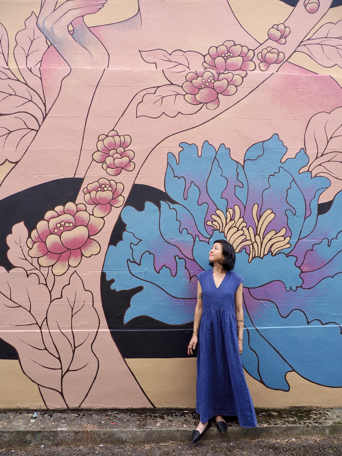 Audrey Kawasaki Posing in Front of Her Mural