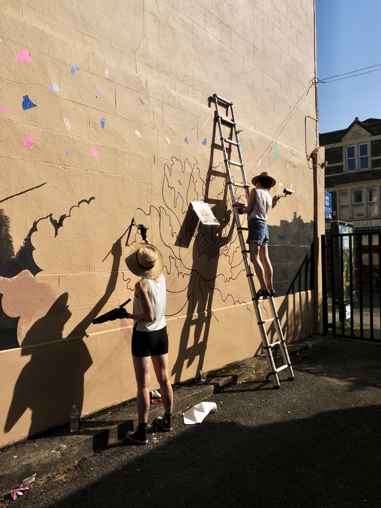 Audrey Kawasaki Working on Her Mural