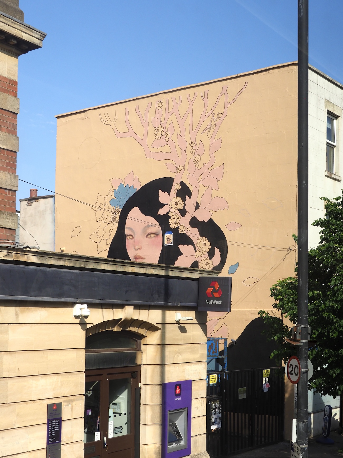 Audrey Kawasaki Working on Her Mural