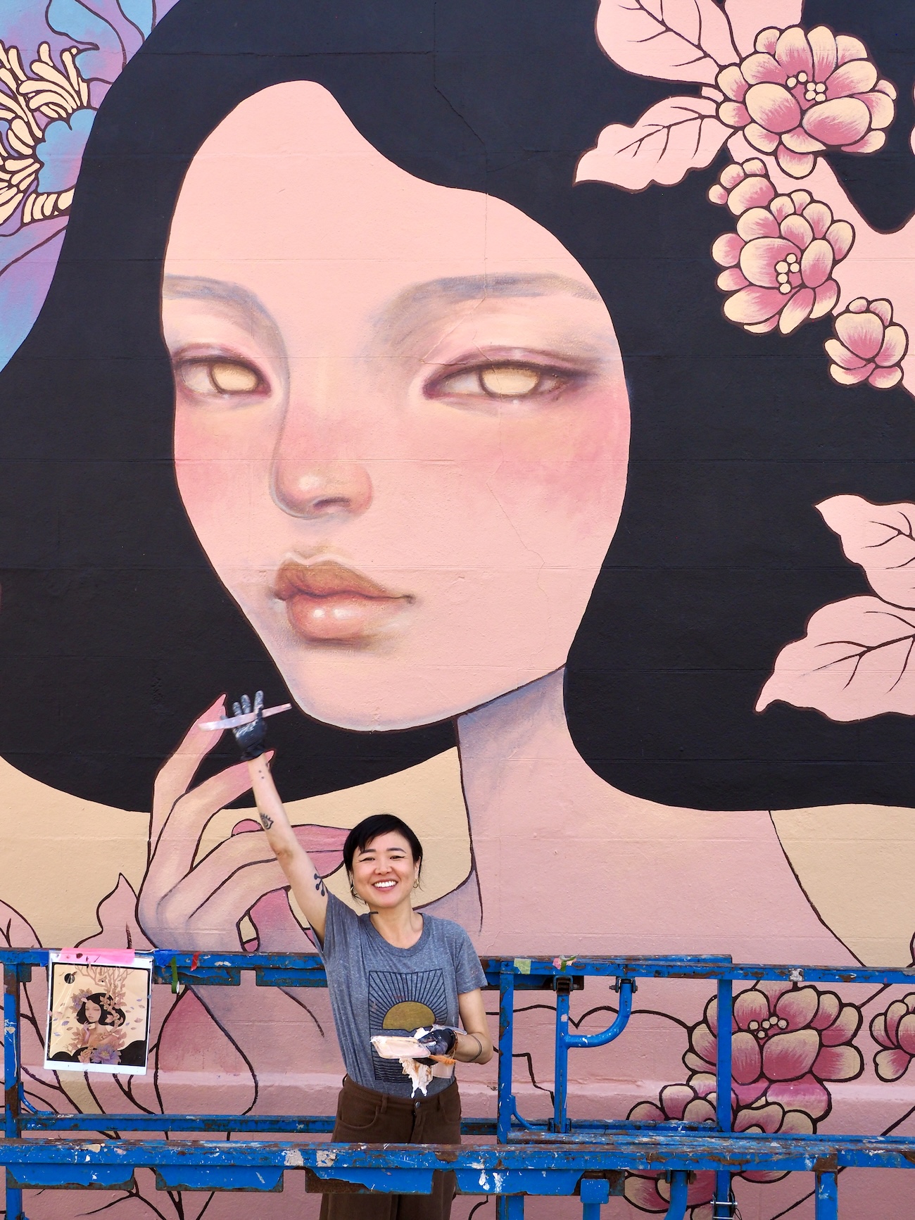 Audrey Kawasaki Working on Her Mural