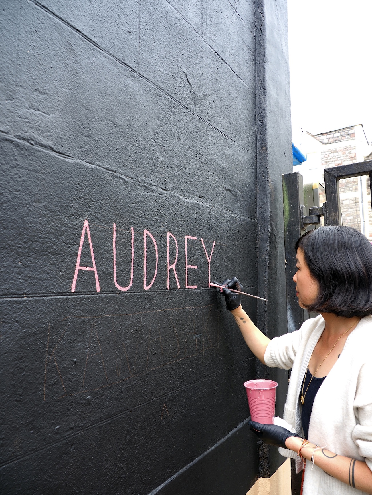 Audrey Kawasaki Working on Her Mural