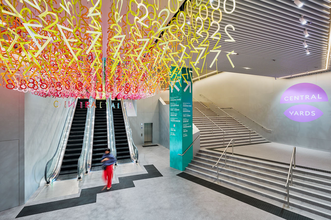 Colorful numerals hang in overlapping rows as part of Emmanuelle Moureaux's FLOW installation.