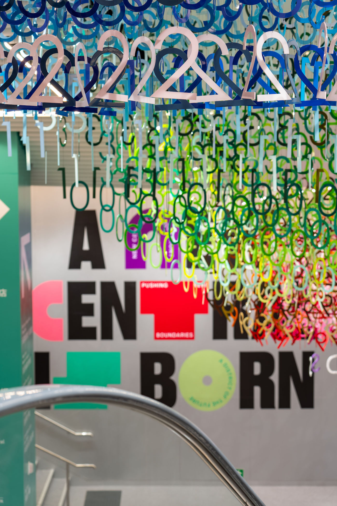 Colorful numerals hang in overlapping rows as part of Emmanuelle Moureaux's FLOW installation.