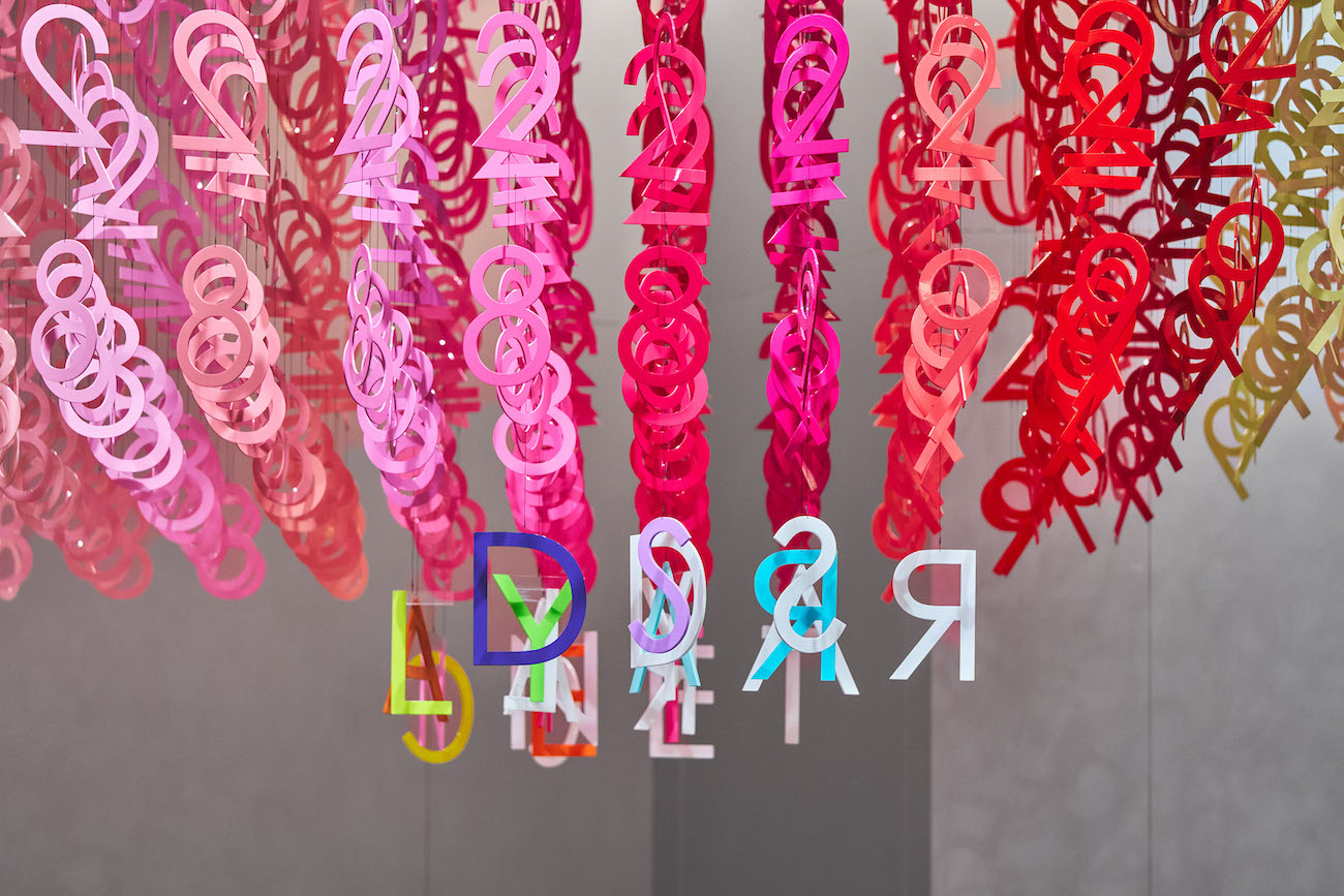 Colorful numerals hang in overlapping rows as part of Emmanuelle Moureaux's FLOW installation.