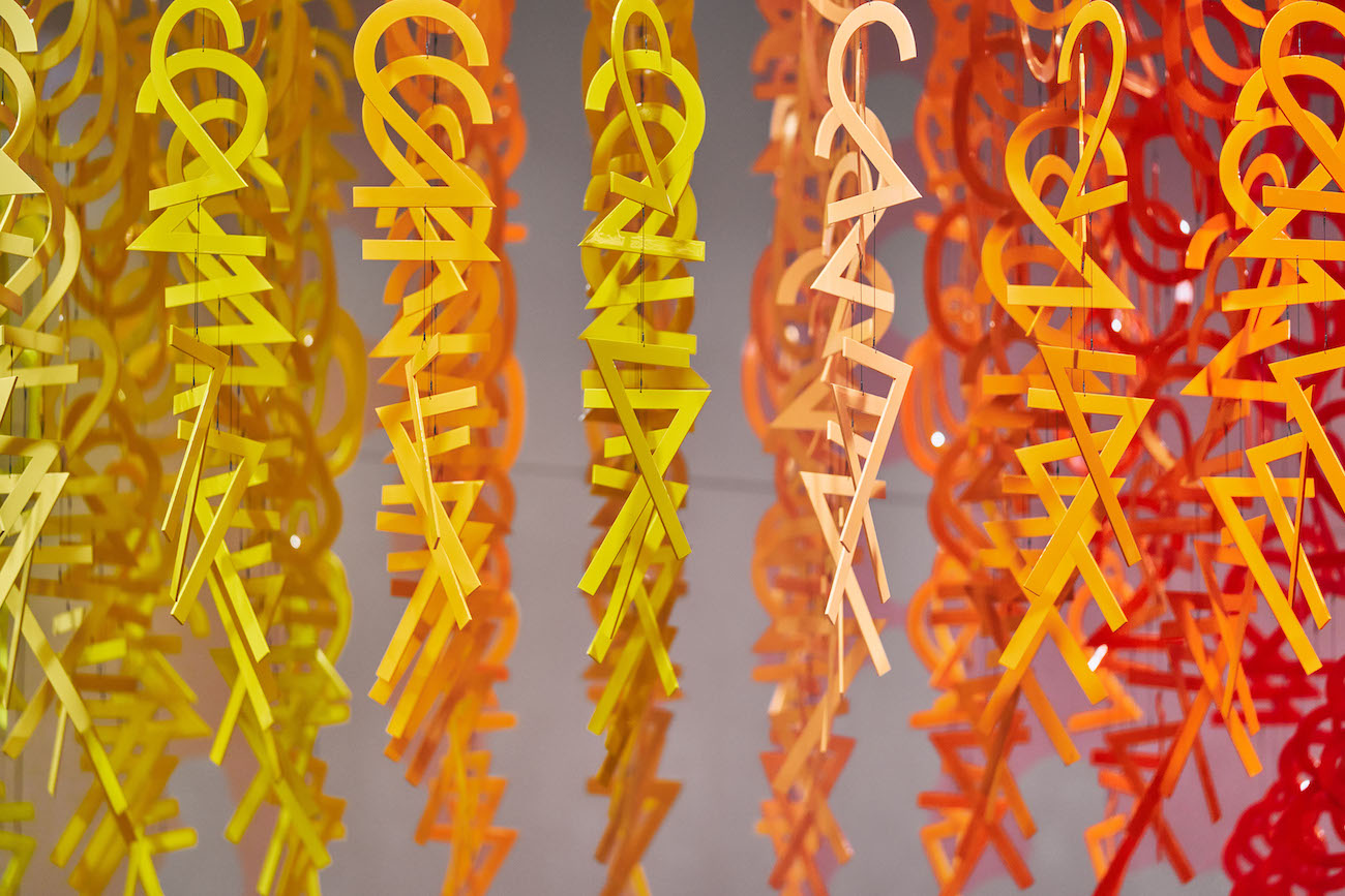 Colorful numerals hang in overlapping rows as part of Emmanuelle Moureaux's FLOW installation.