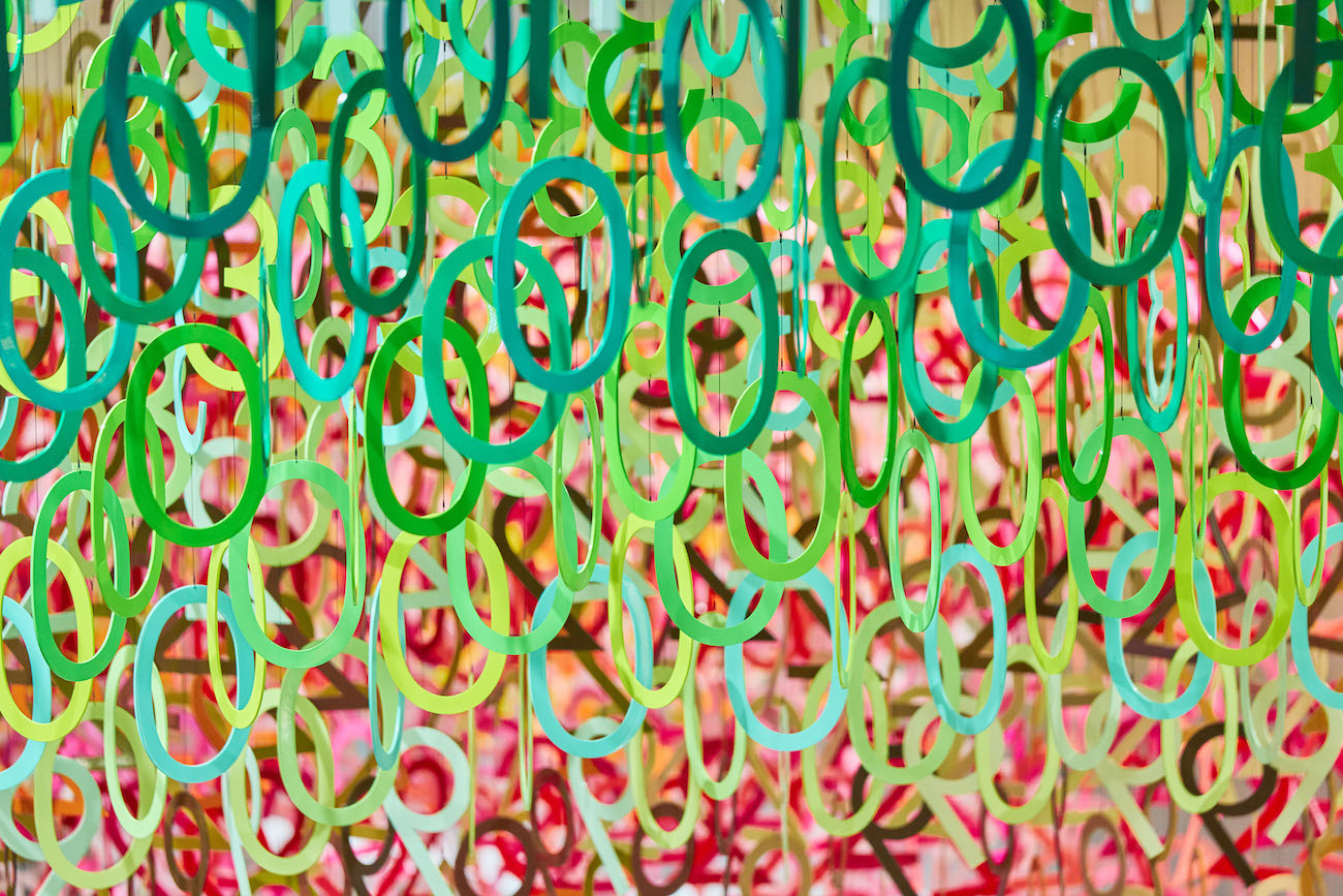 Colorful numerals hang in overlapping rows as part of Emmanuelle Moureaux's FLOW installation.