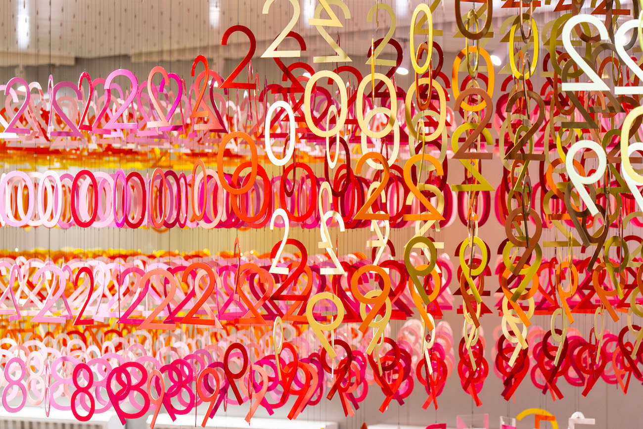 Colorful numerals hang in overlapping rows as part of Emmanuelle Moureaux's FLOW installation.