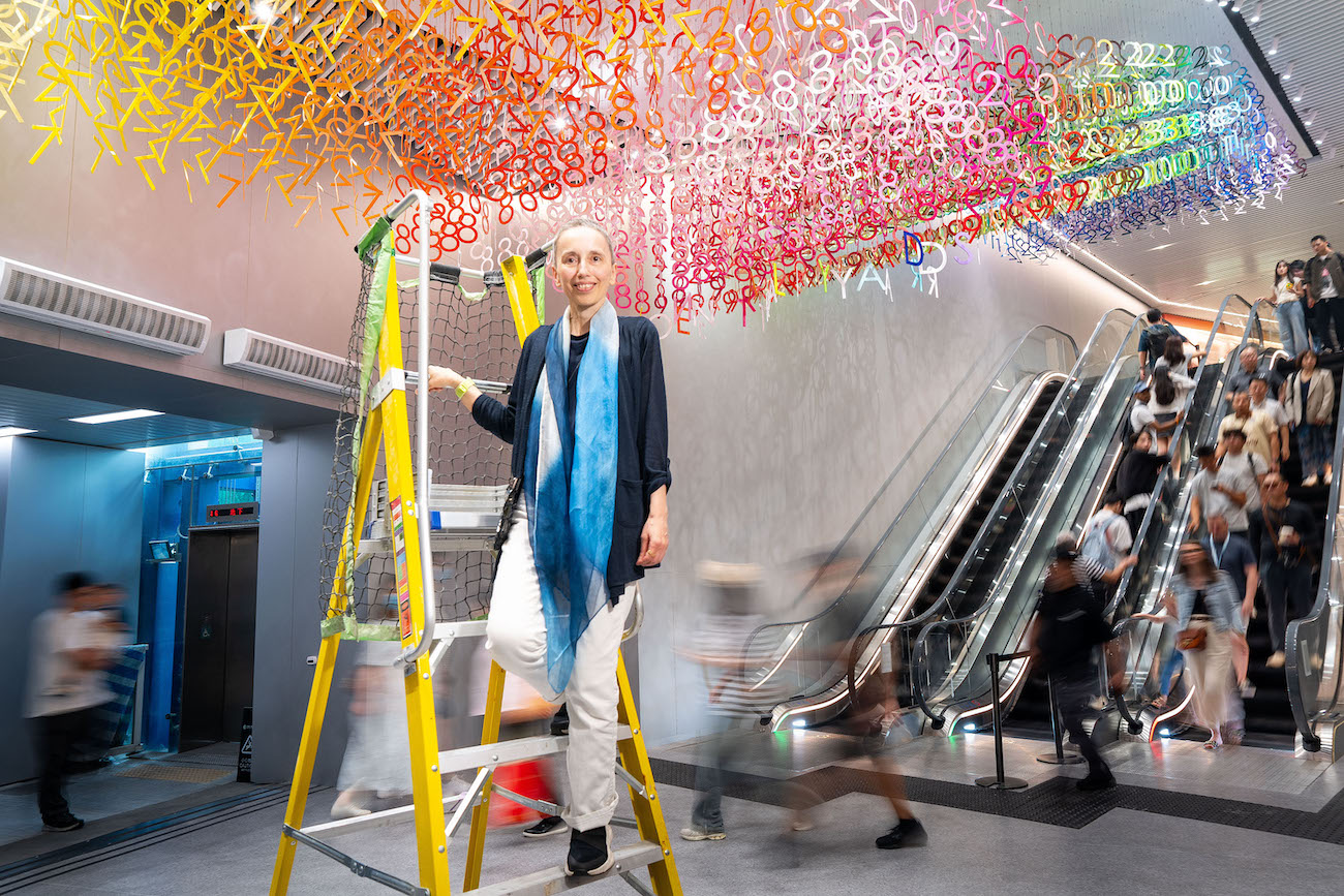 Colorful numerals hang in overlapping rows as part of Emmanuelle Moureaux's FLOW installation.
