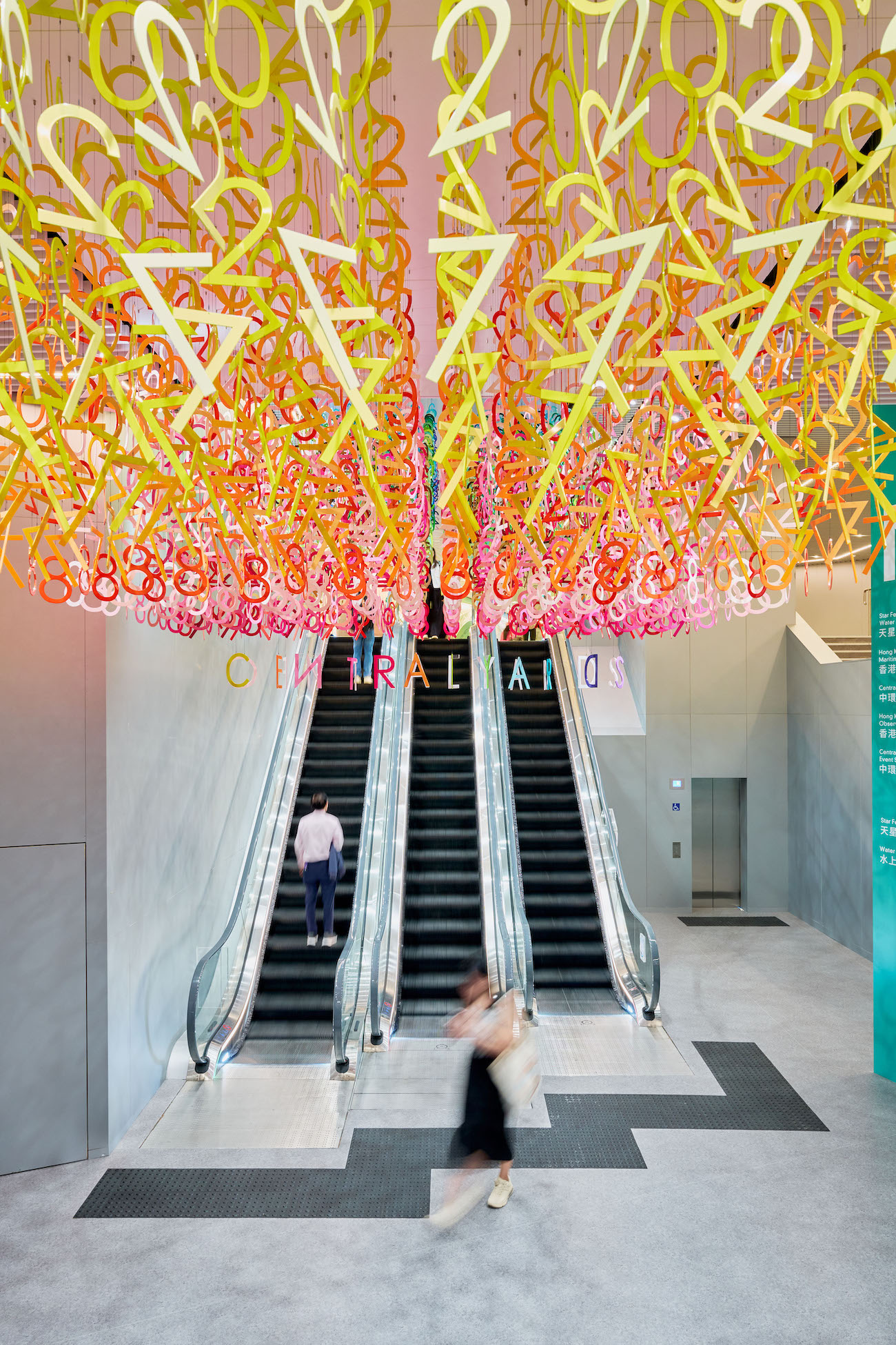 Colorful numerals hang in overlapping rows as part of Emmanuelle Moureaux's FLOW installation.