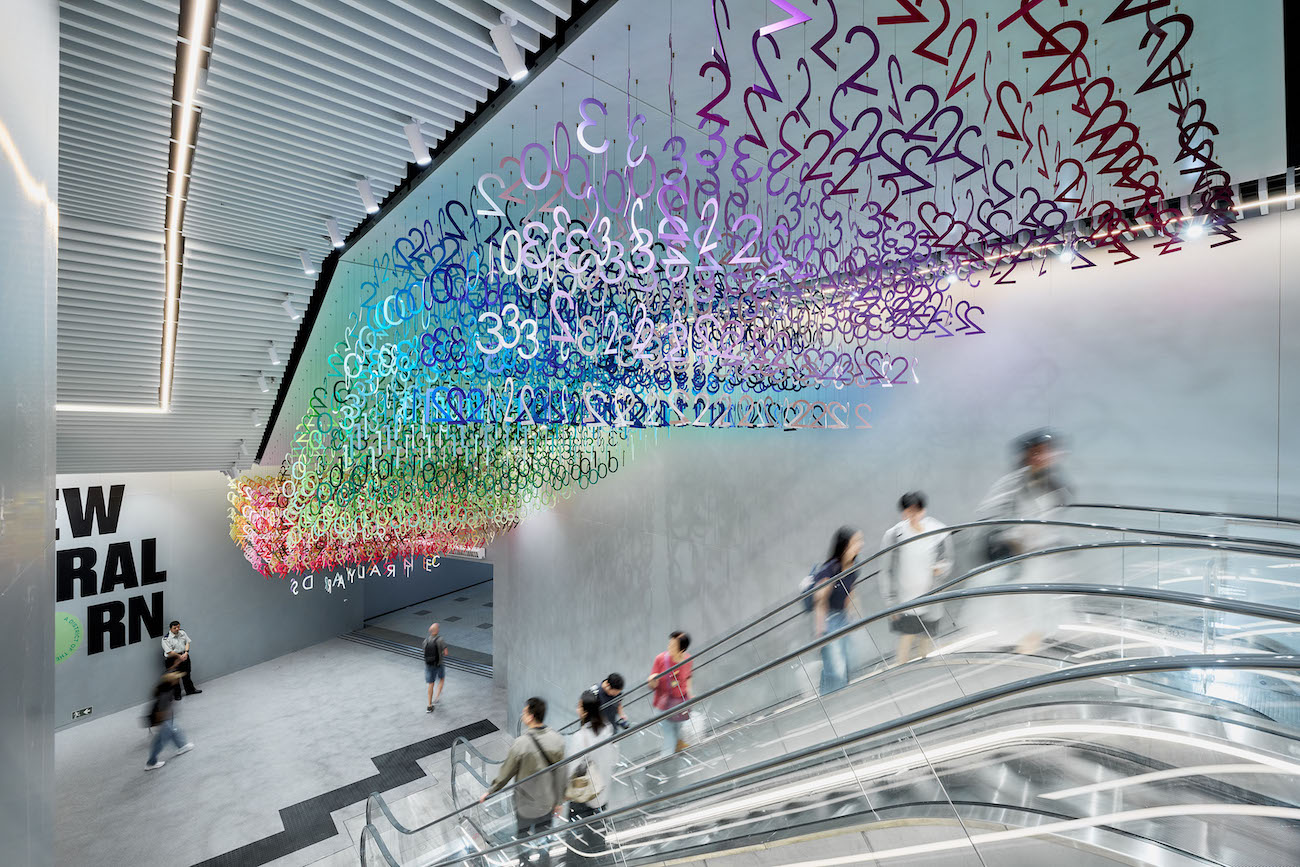 Colorful numerals hang in overlapping rows as part of Emmanuelle Moureaux's FLOW installation.