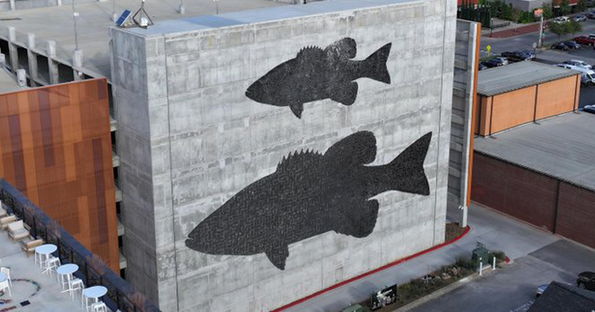 Shimmering Public Art Has Giant Fish “Swimming” on the Side of a Parking Garage