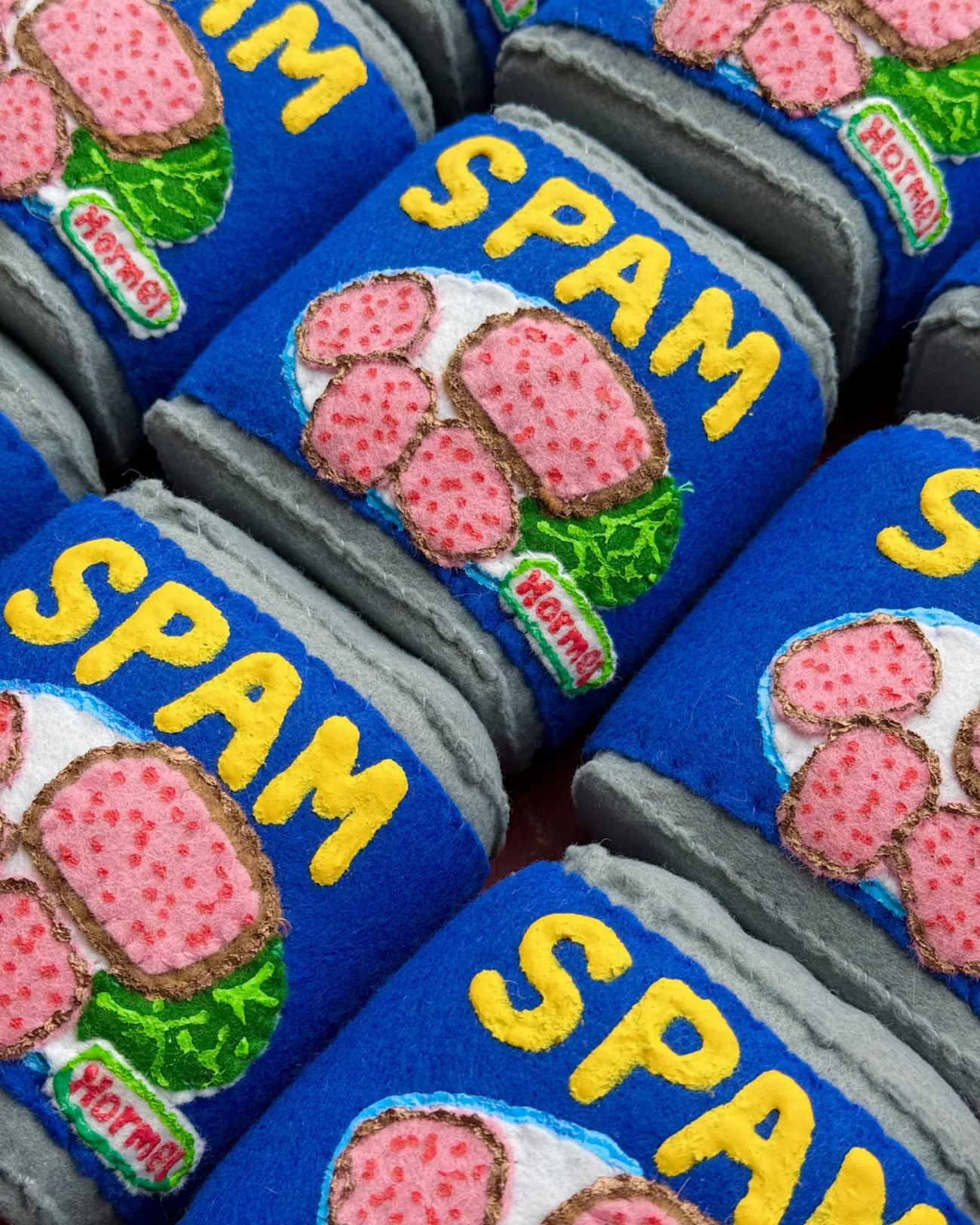 Cans of spam reimagined in felt by artist Lucy Sparrow